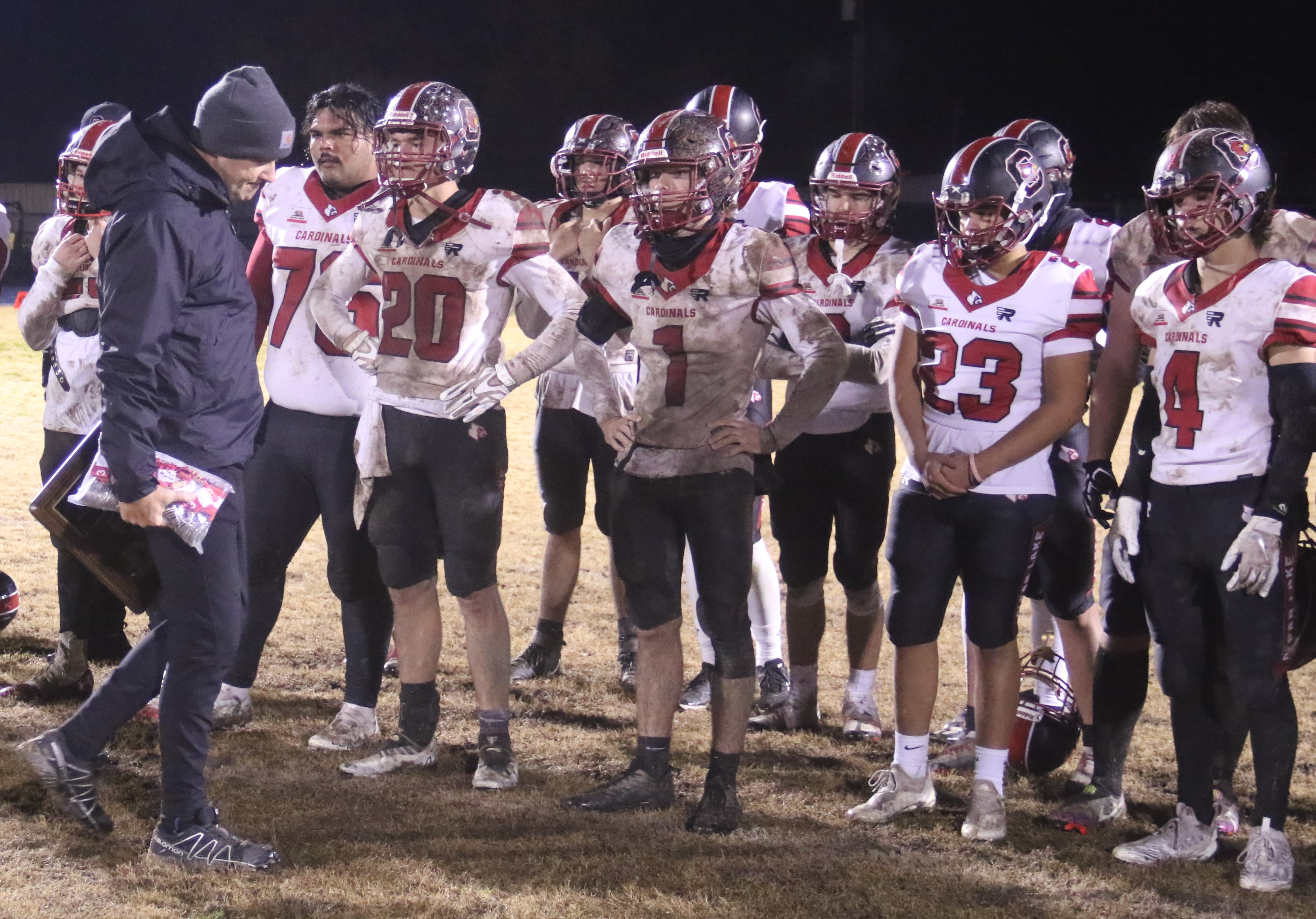 Clear Lake head coach Mark Cory and the Cardinals look on as Orland receives its NorCal championship plaque following the game Saturday night at Orland High School. The Cardinals won North Central League I and North Coast Section titles this season before falling to the Trojans 42-21 in the 5-A NorCal championship game. (Photos by Minenna Photography)
