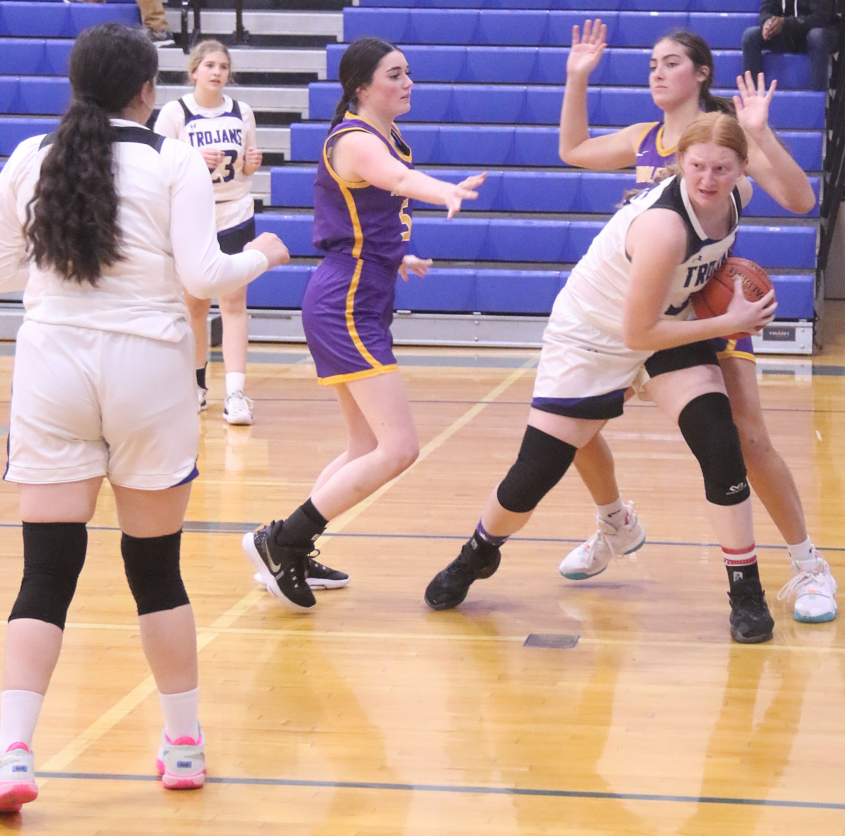 Lower Lake's Rebecca Theodorou pulls down the rebound in front of Middletown's Kamryn Atkins (5) and Skylar Williams during action Tuesday night in Lower Lake. (Photos by Minenna Photography)
