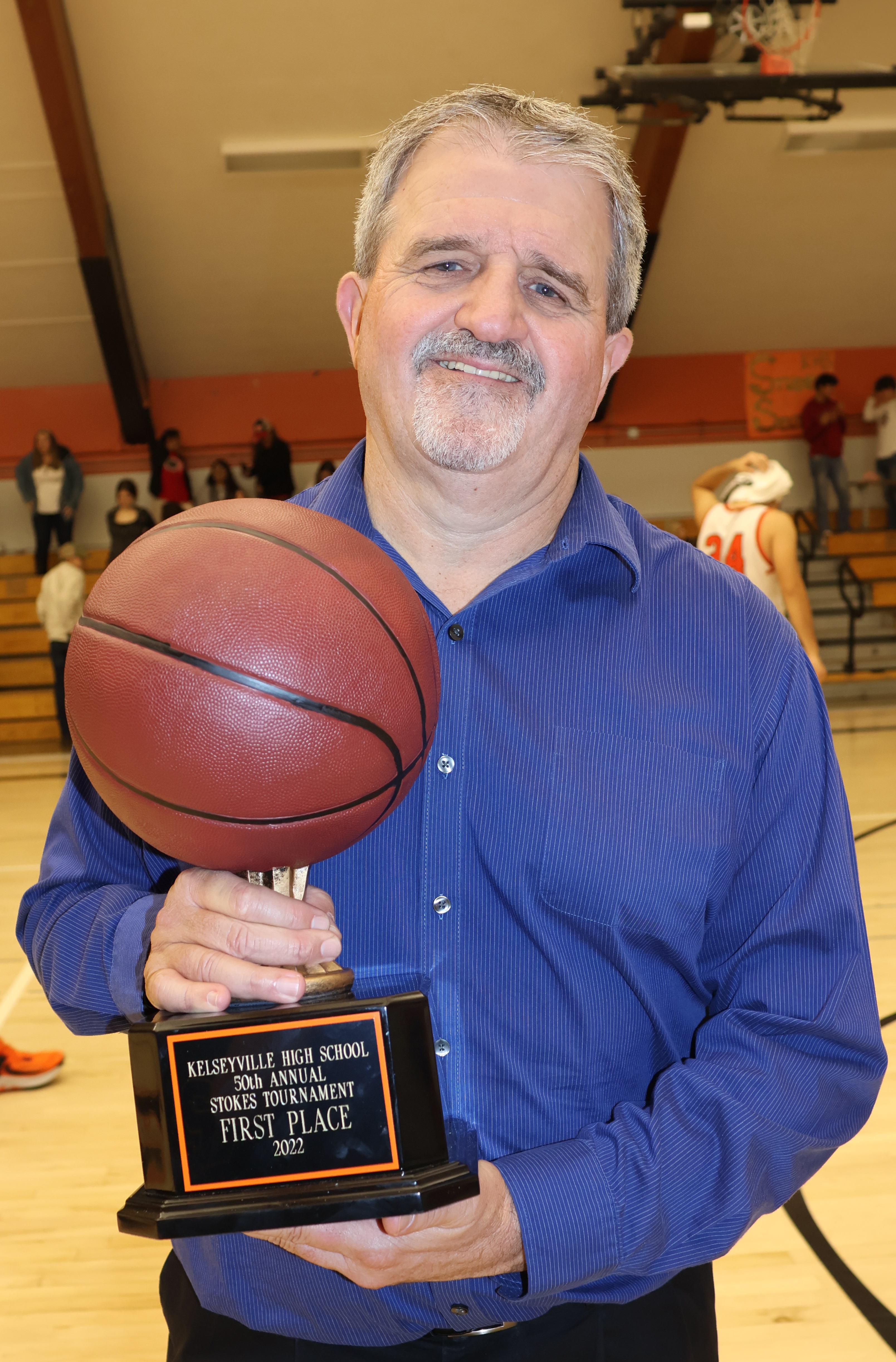 Ukiah High School head coach Duane Nelson holds the Stokes Tournament championship trophy. (Photos by Brian Sumpter)
