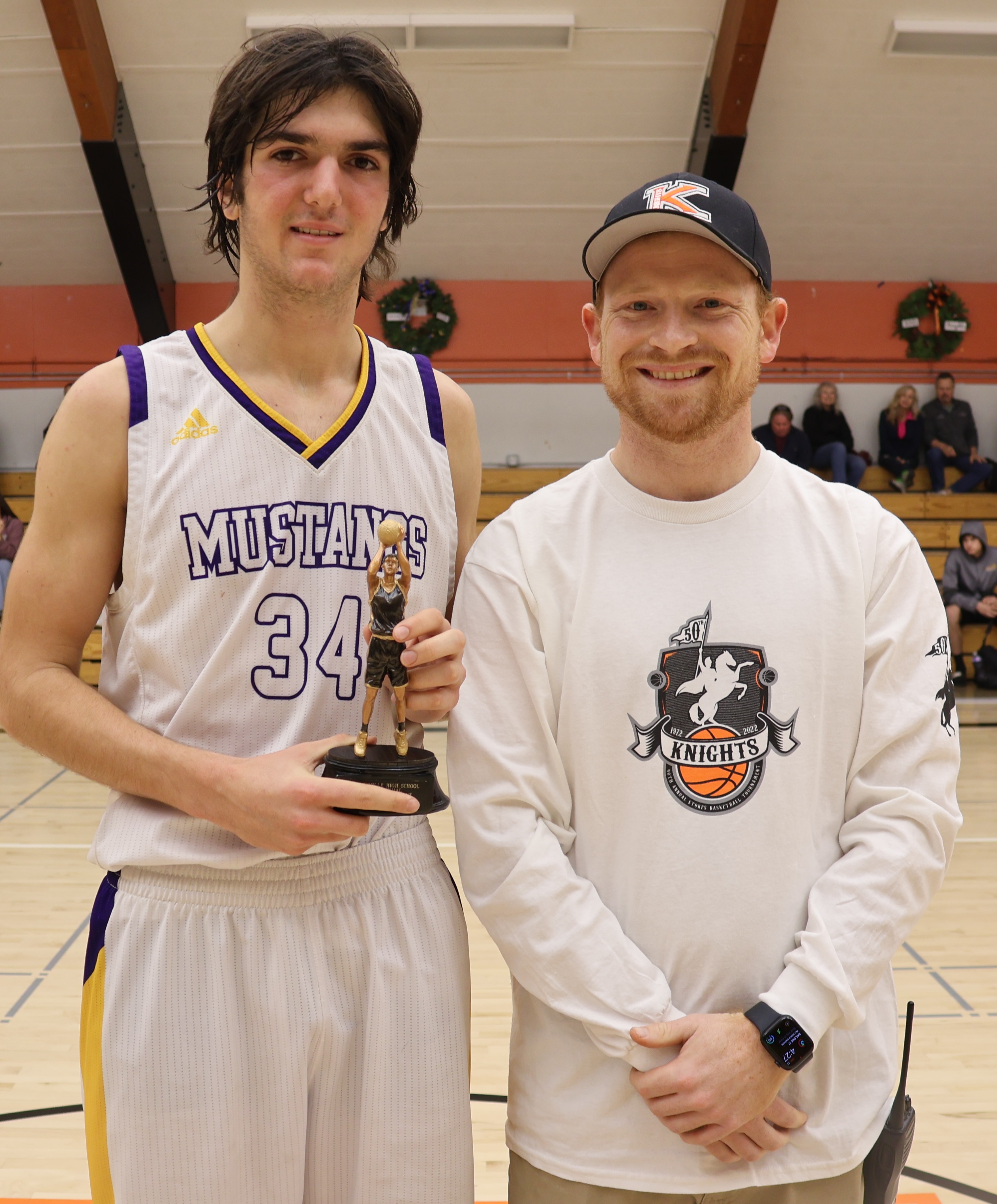 All-Tournament selection Nadav Dicovski of Middletown scored a season-high 28 points in a 70-35 victory over Potter Valley on Saturday night. He received his award from Kelseyville High School athletic director Shane Boehlert. (Photos by Brian Sumpter