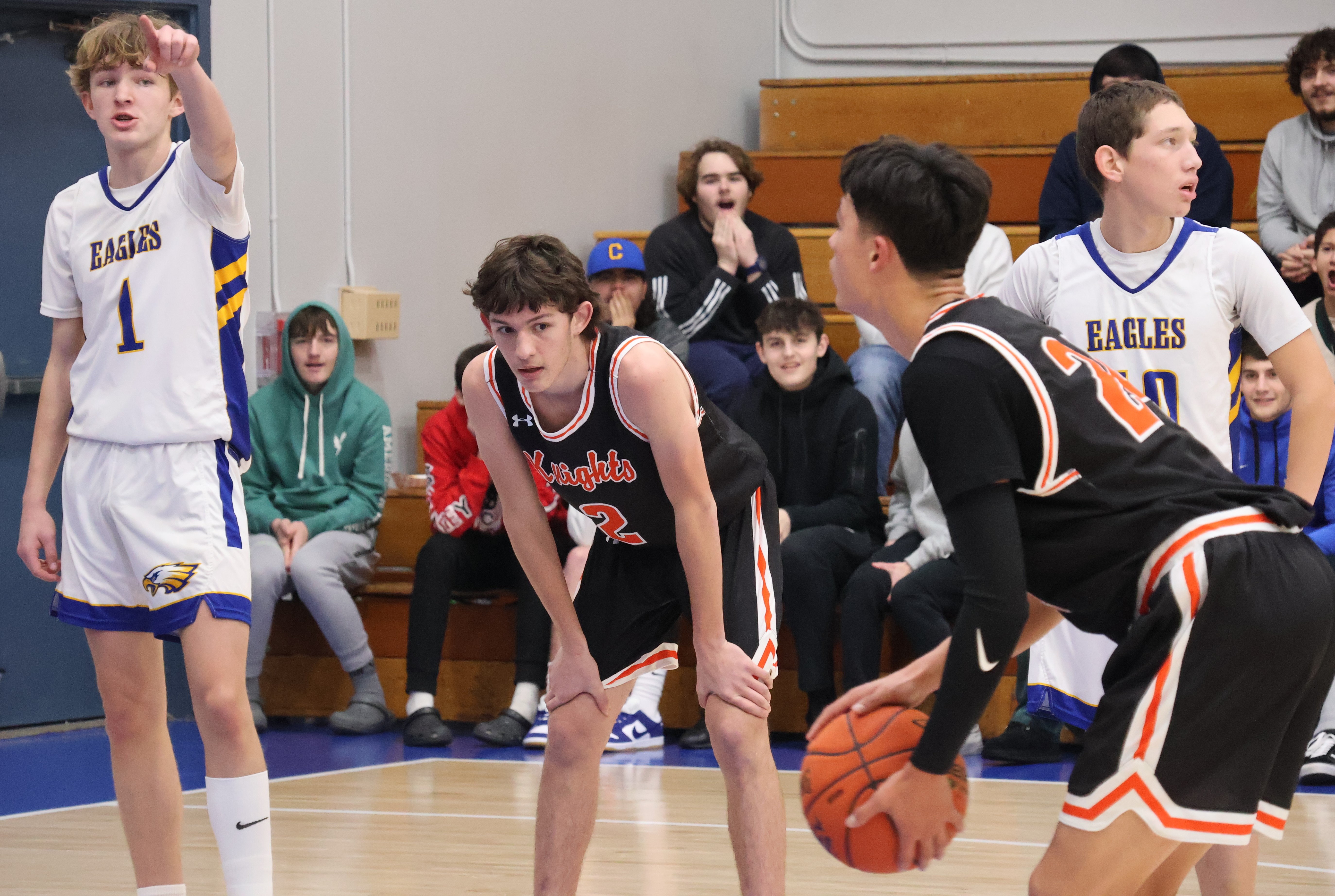 Kelseyville's Luke Watkins prepares to shoot a free throw as teammate Gene Holdenried and Cloverdale's Tatum Kurpinsky (1) and Emilio Diaz look on.