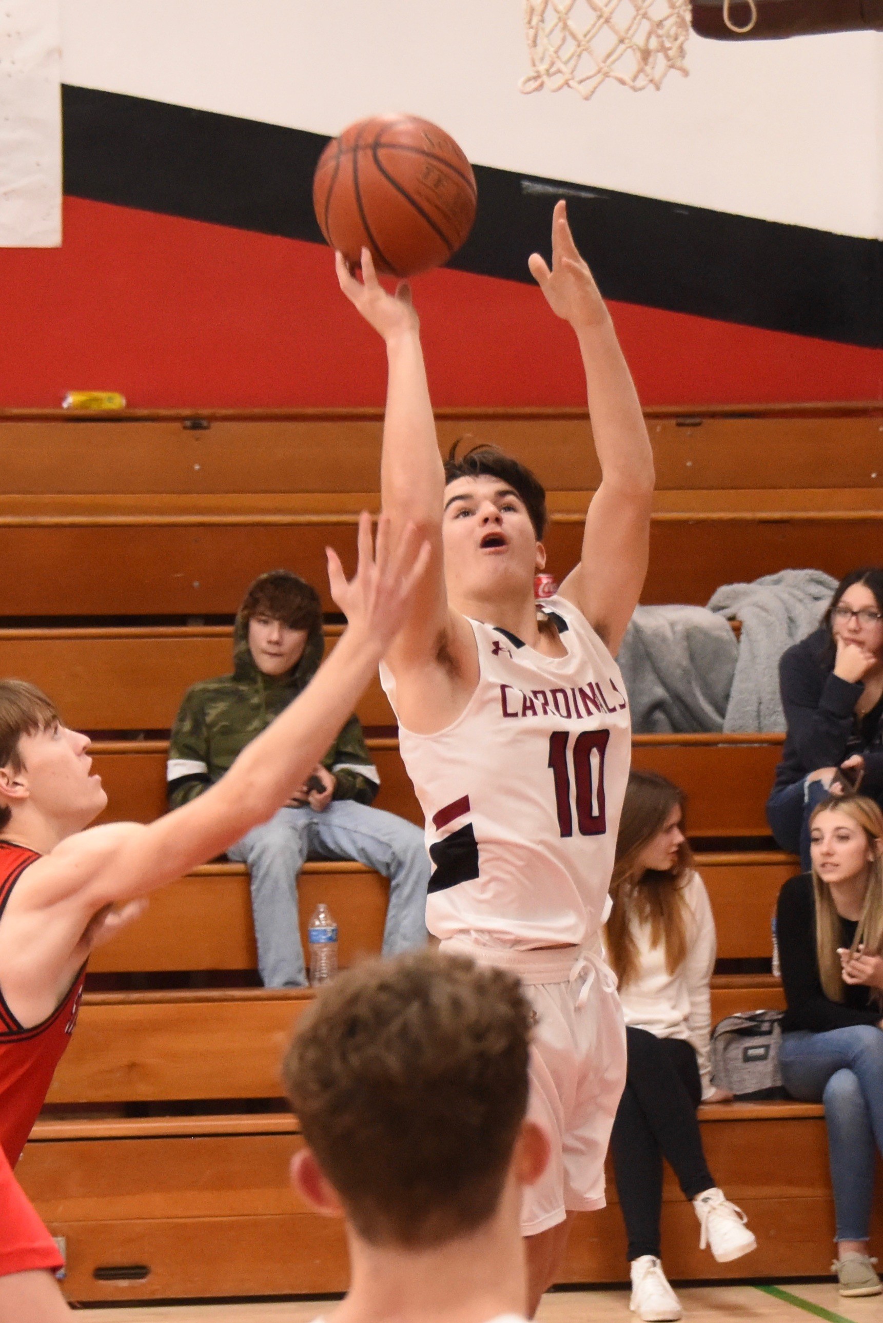Clear Lake's Jesse Hayes drives inside for two of his 11 points Tuesday against St. Helena. (Photos courtesy of Trett Bishop)