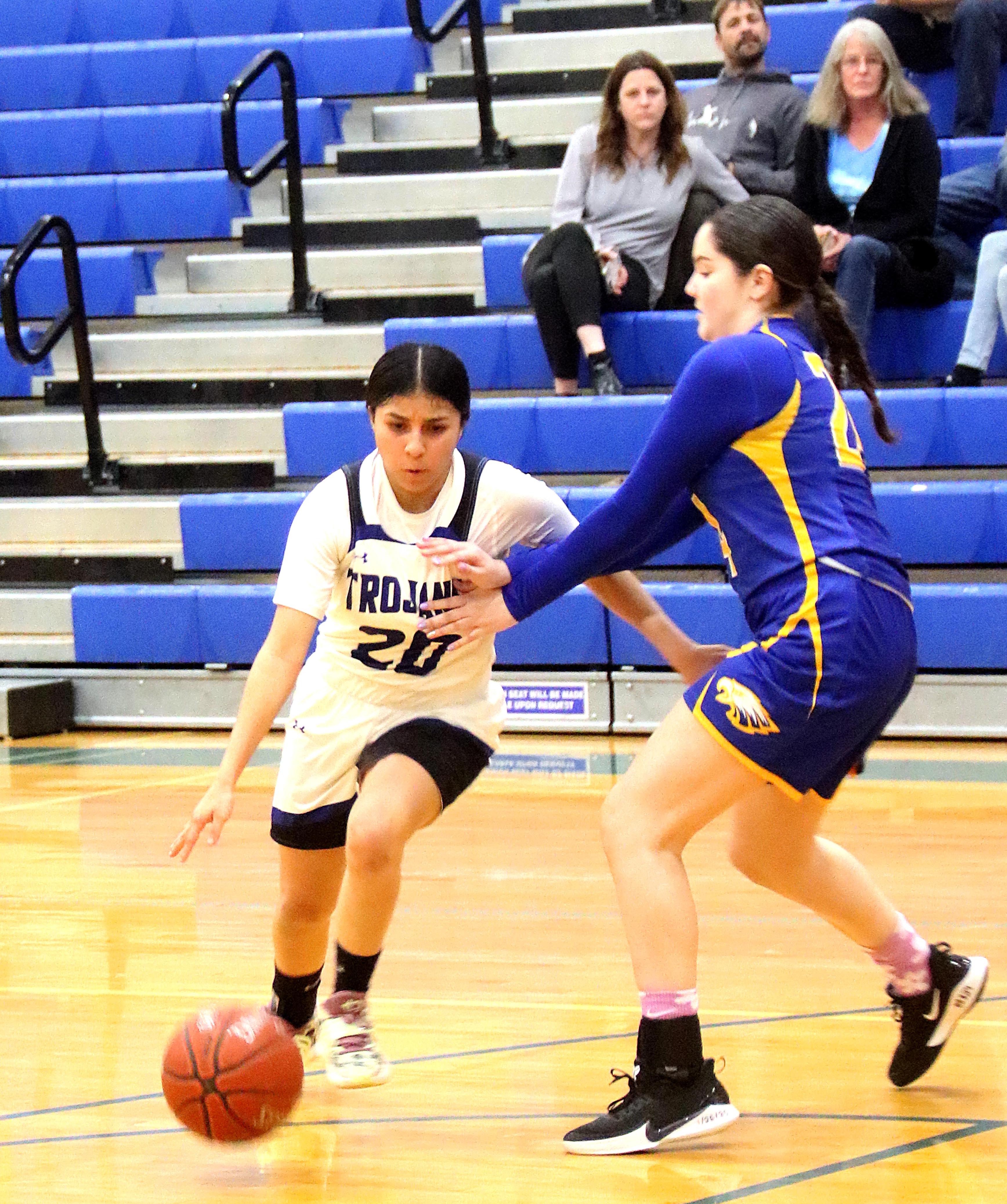 Lower Lake's Samantha Hernandez brings the ball down the floor for the Trojans against Cloverdale. (Photos by Minenna Photography)