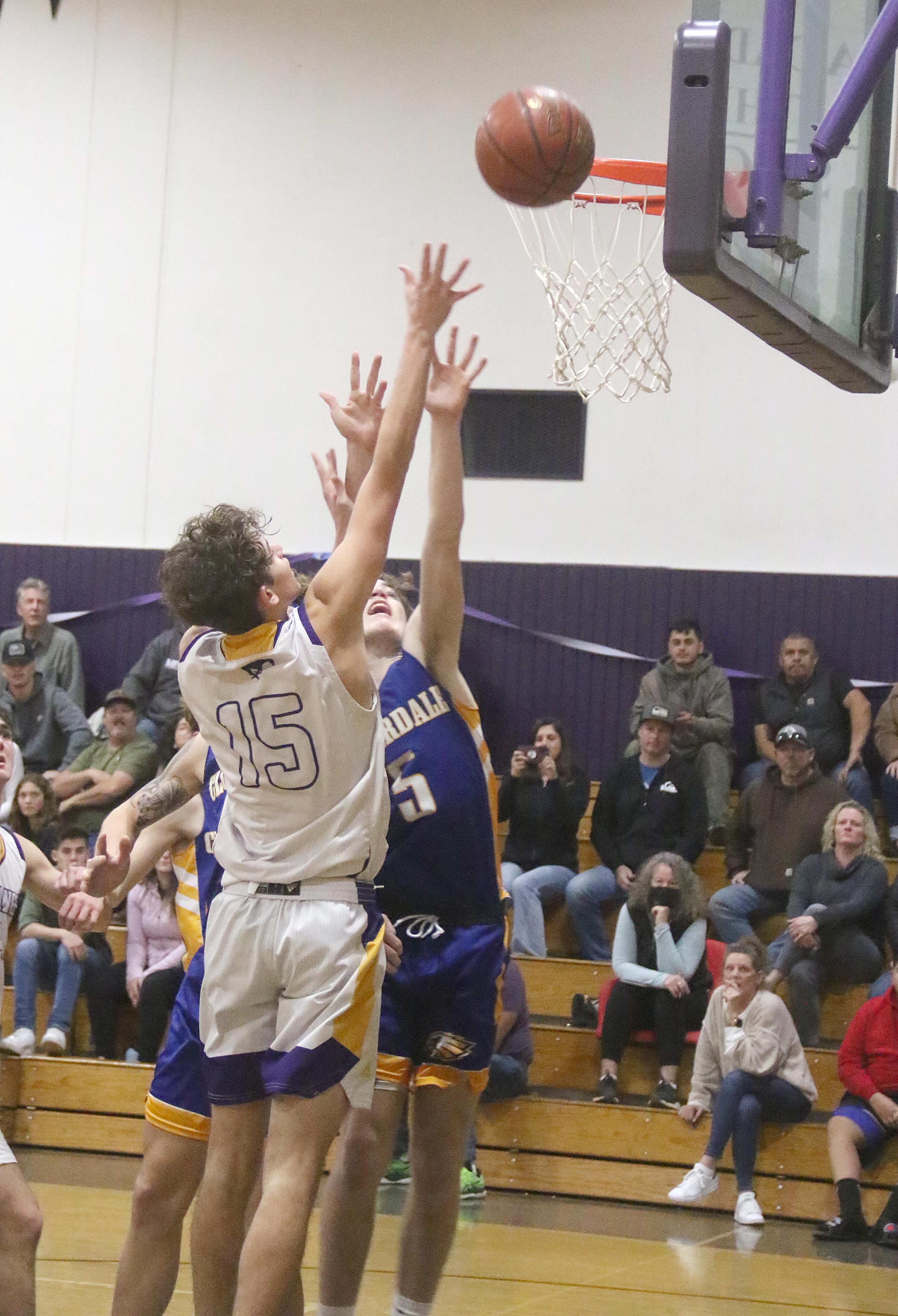 Middletown's Wyatt Moore releases a shot down low against Cloverdale. Moore scored seven points in a 57-42 loss to the Eagles. (Photos by Minenna Photography)