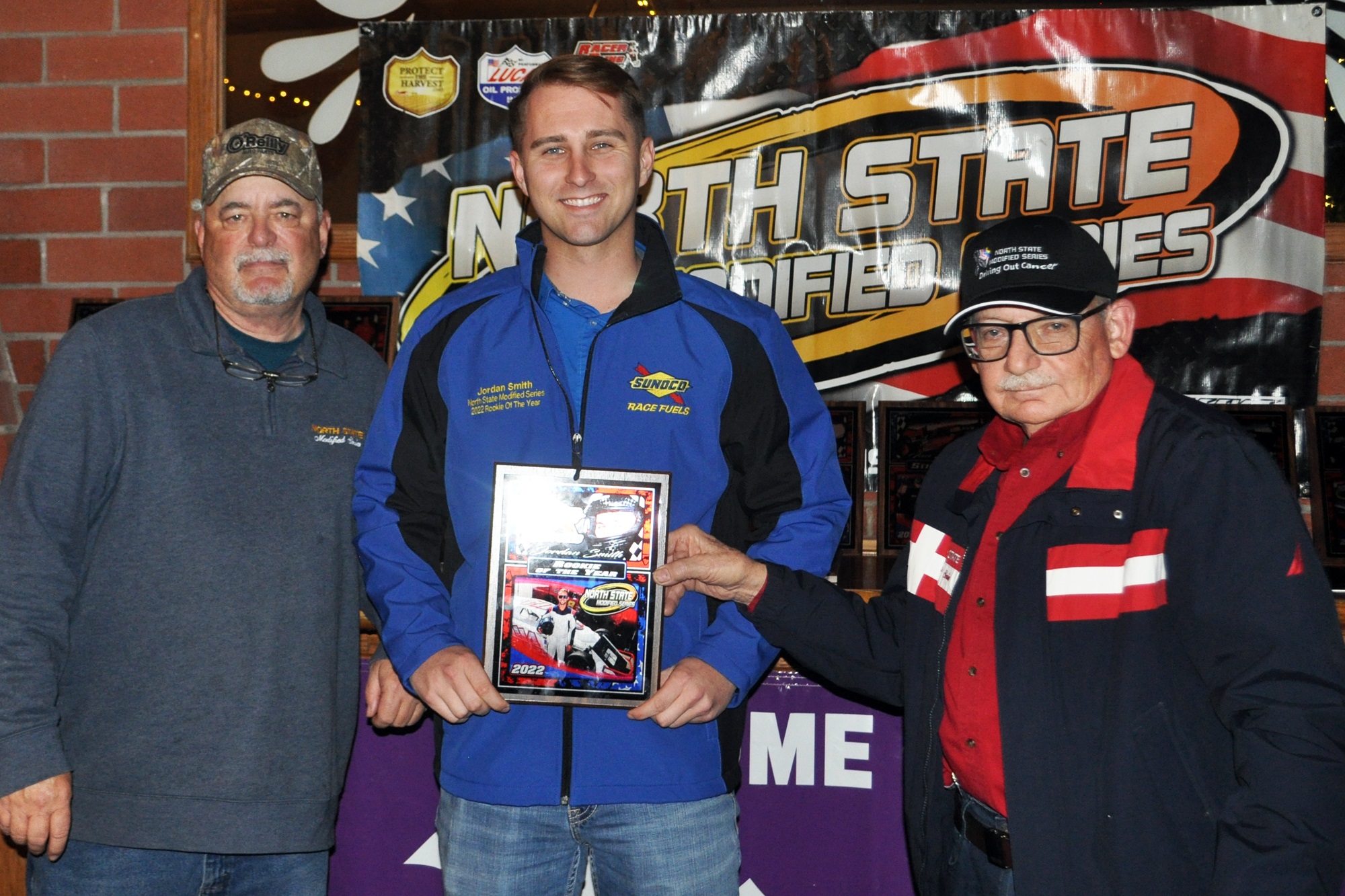 Jordan Smith (center) of Sacramento is the 2022 NSMS Sunoco Rookie of the Year. Presenting him his award are series promoters Jeff Stephens (left) and Bob Strauss. (Courtesy photos)