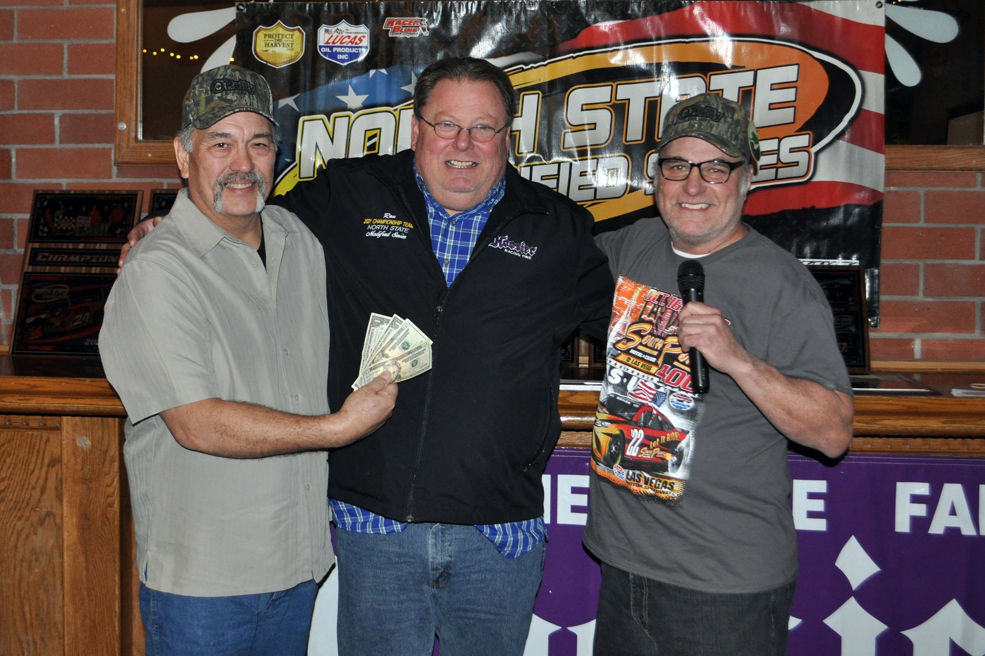 Ron Ostererro (center), crew chief for NSMS champion Scott Winters, was presented with the Crew Chief award by the racing team of Jim McGarry (left) and Rick Avila. (Courtesy phtoos)