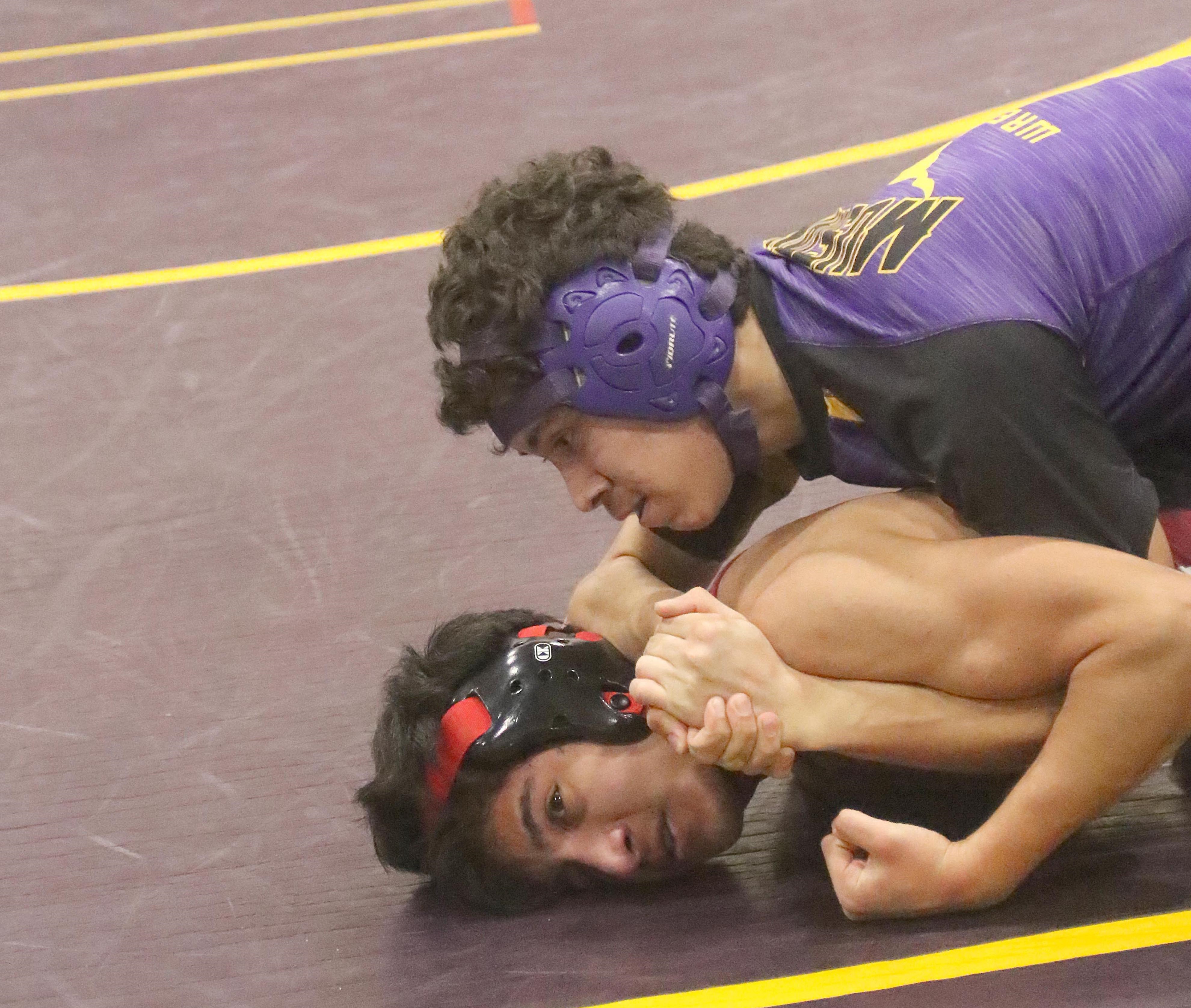 Middletown's Joe Cortez (top) went on to pin Clear Lake's Joel Rios in the first round at 132 pounds. (Photos by Minenna Photography)