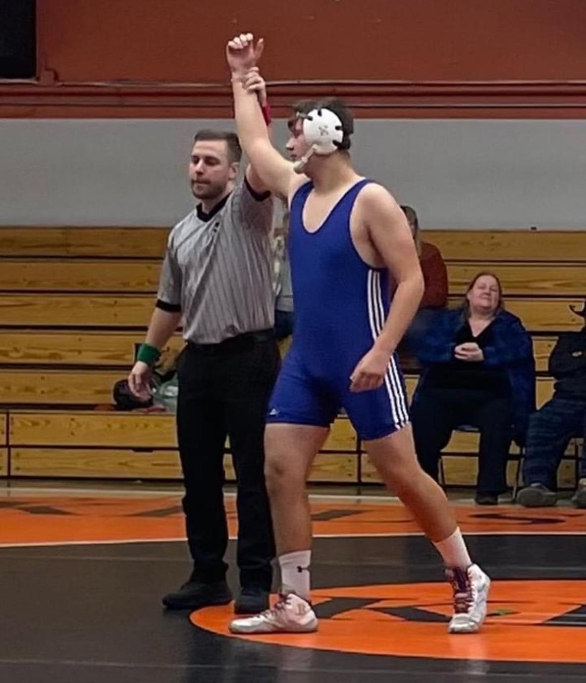 Lower Lake's Adam Viramontes wrestled up a weight class but still won his heavyweight division match Wednesday against Kelseyville. It was an emotional victory for the young man, who lost his father on Friday. (Courtesy photos)