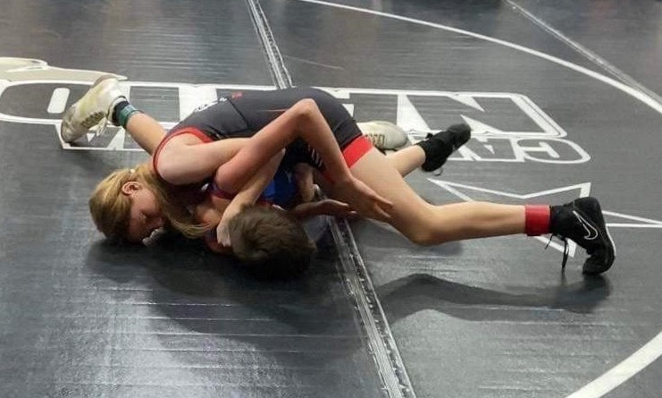 Riley Givens of the Gladiator Wrestling Club applies a half nelson against her opponent. (Courtesy photo)