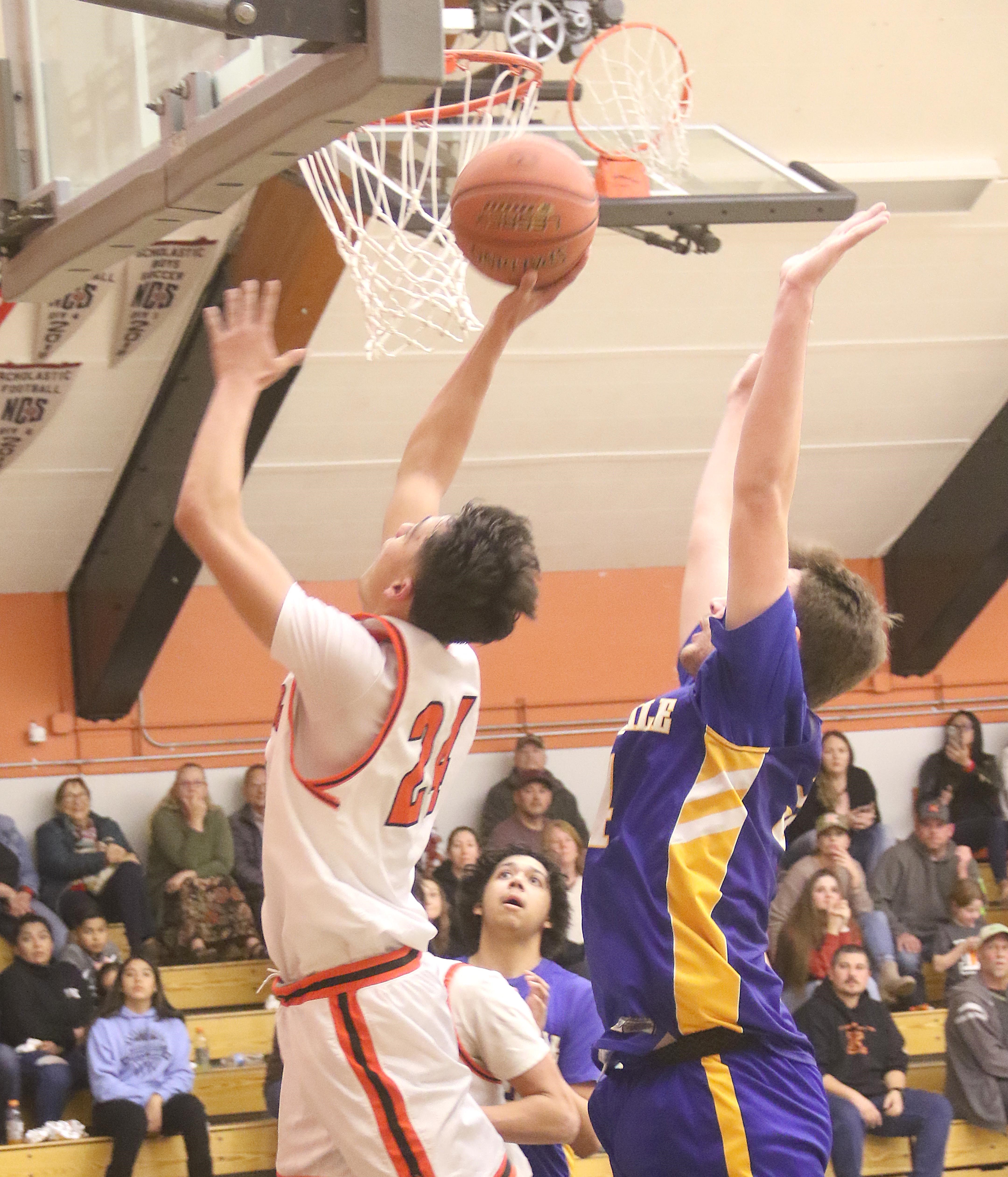 Kelseyville's Luke Watkins scores two of his team-leading 26 points with a drive inside. (Photos by Minenna Photography)