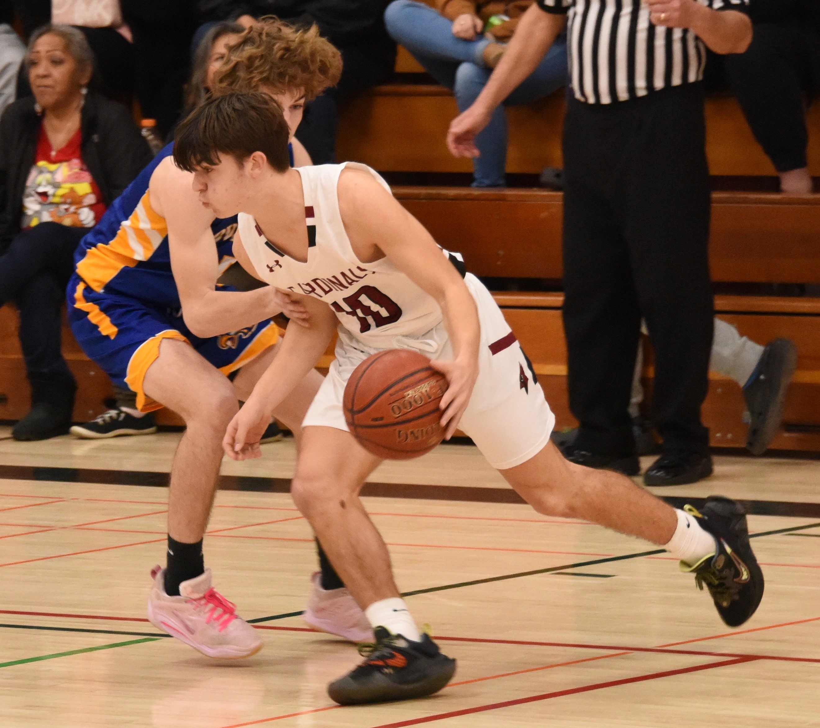 Clear Lake's Jesse Hayes drives around a Cloverdale defender during Thursday's action in Lakeport. (Photos courtesy of Trett Bishop)