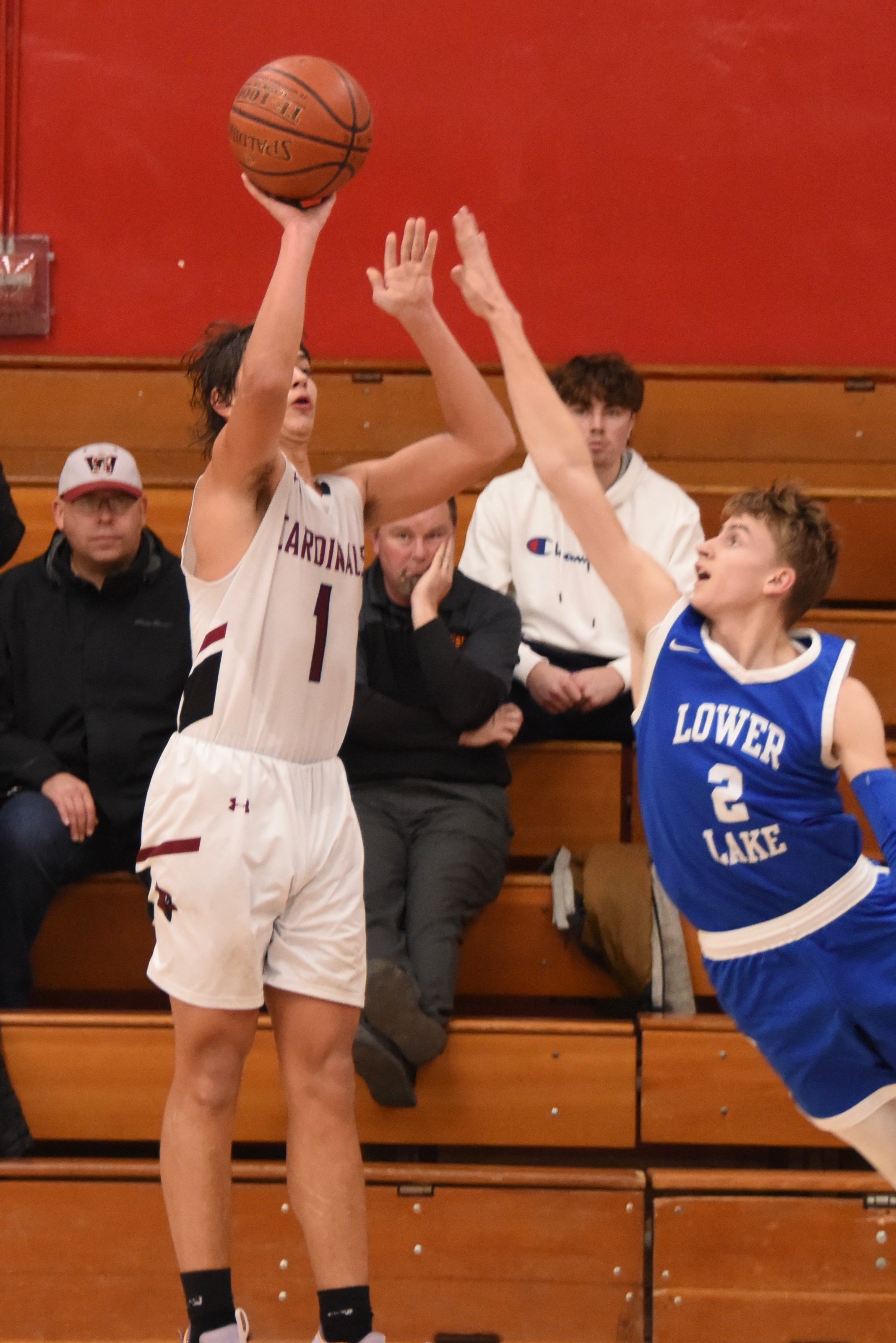 Clear Lake's Graden Greer puts up a 3-point shot just out of the reach of Lower Lake's Dylan Sherman on the game's final sequence. The shot missed but Cody Hayes rebounded it and scored at the buzzer to beat Lower Lake 67-66 on Wednesday night in Lakeport. (Photos courtesy of Trett Bishop)