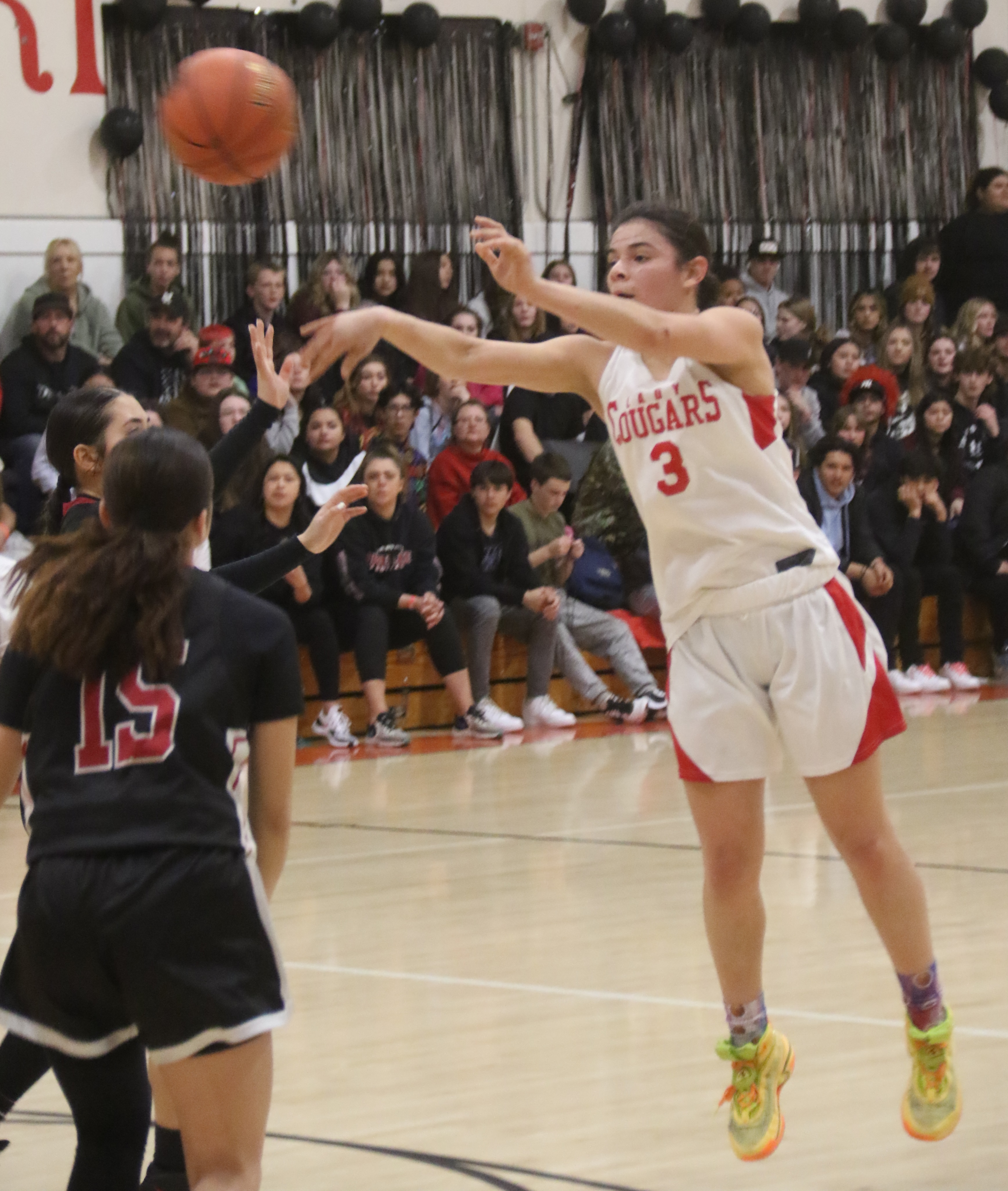 Upper Lake's Maddy Young fires a pass inside to teammate Taylar Minnis, who scored on the play. (Photos by Minenna Photography)