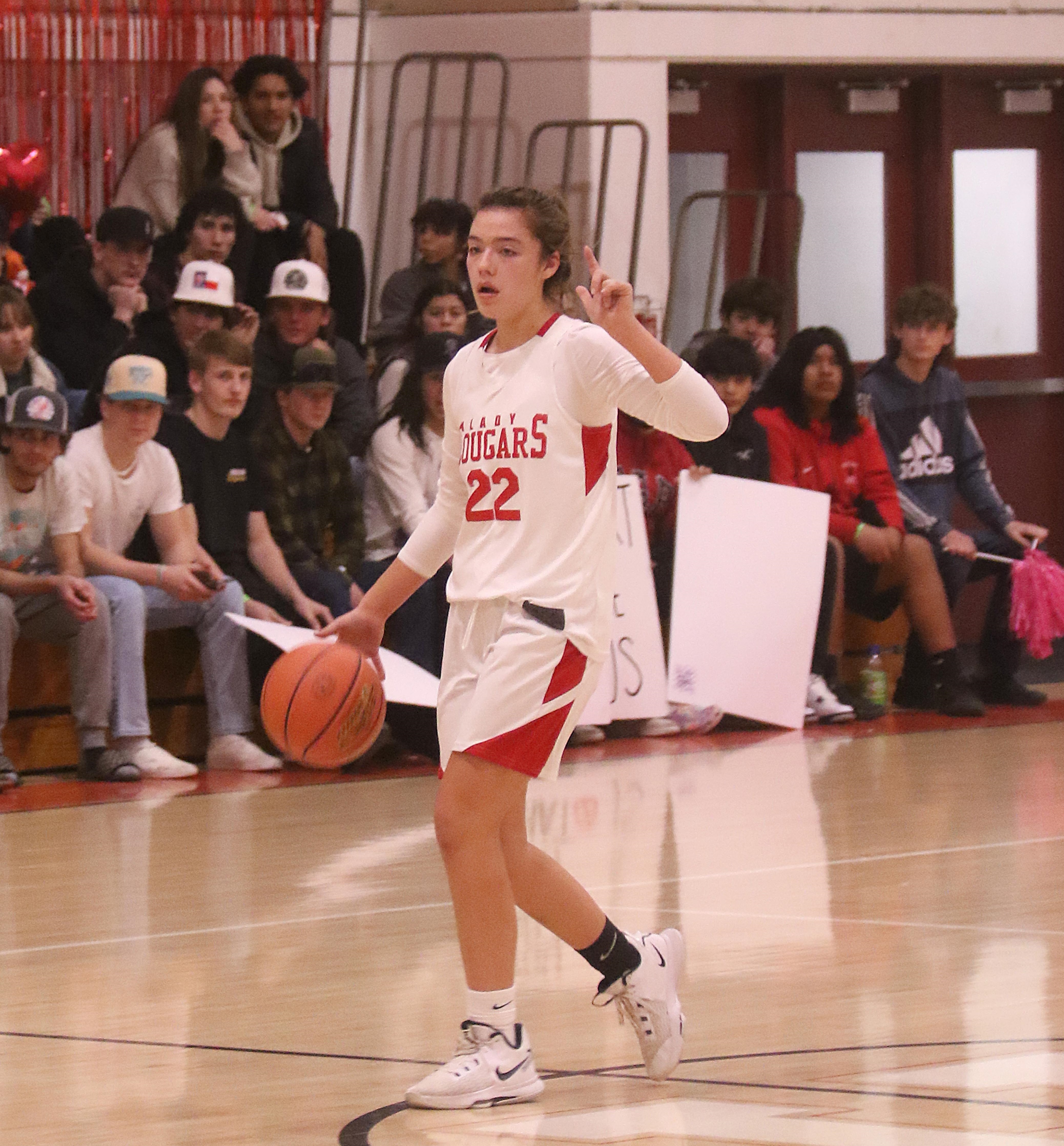 Upper Lake's Nya Marcks brings the ball across midcourt while calling out a play. (Photos by Minenna Photography)