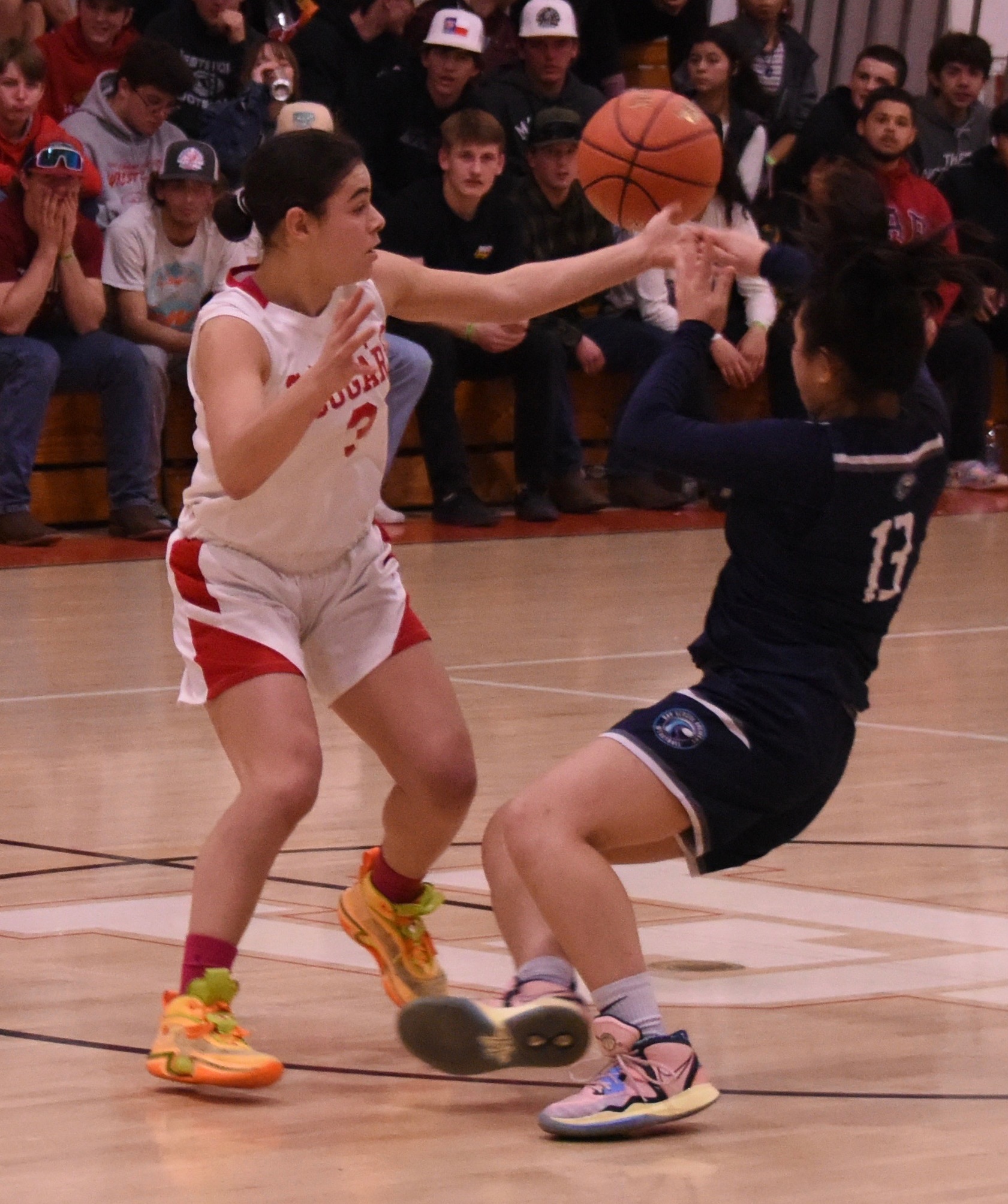 Maddy Young deflects a pass intended for The Bay School's Katie Wu on Tuesday night in Upper Lake. Young's defense was a major contributing factor in the Cougars' 47-29 first-round playoff victory. (Photos courtesy of Trett Bishop)
