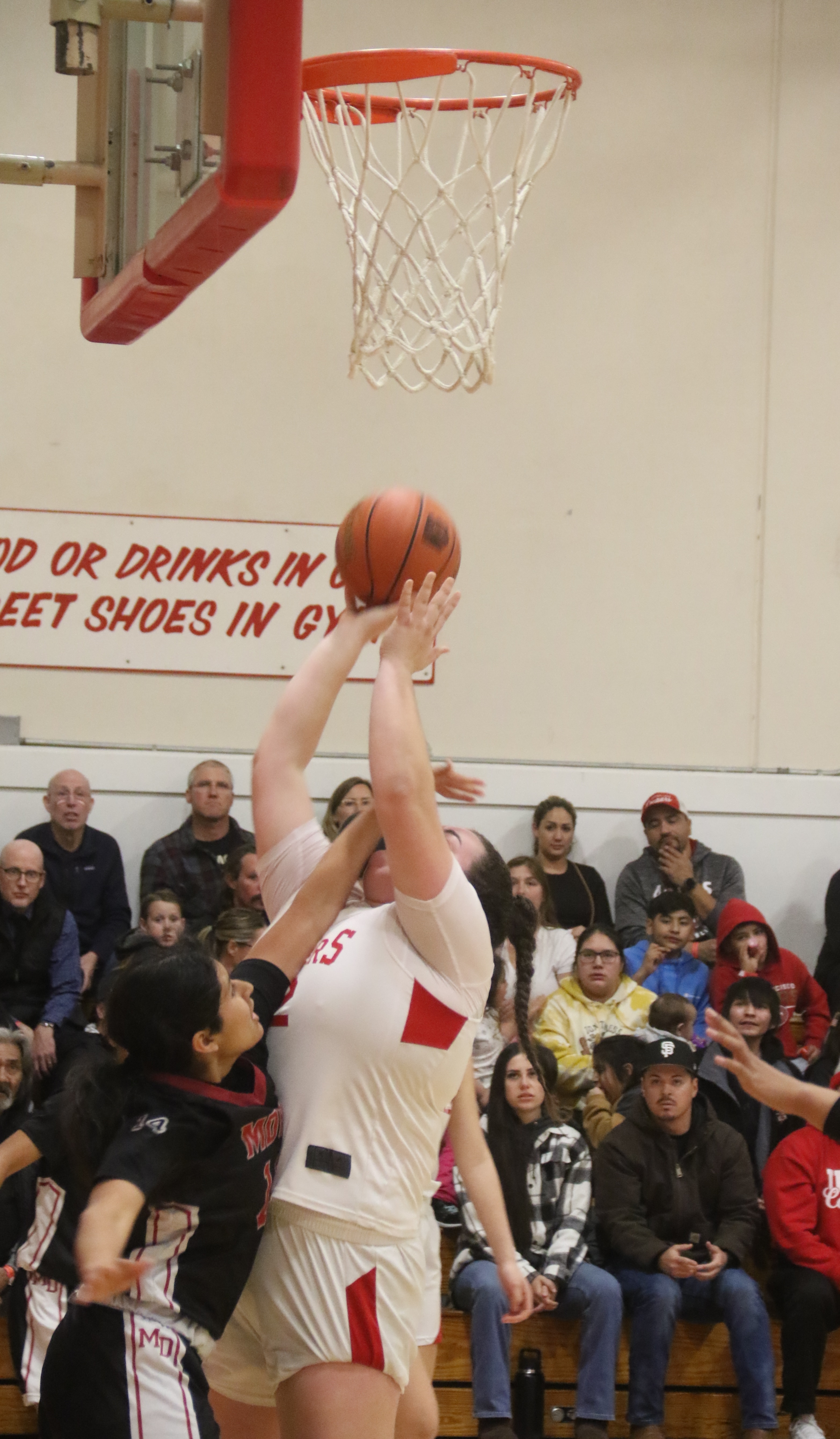 The Mount Diablo Red Devils did all they could to harass Upper Lake center Taylar Minnis, including a hand into the face on this play. Minnis had the last laugh as she scored 28 points against the Red Devils. (Photos by Minenna Photography)