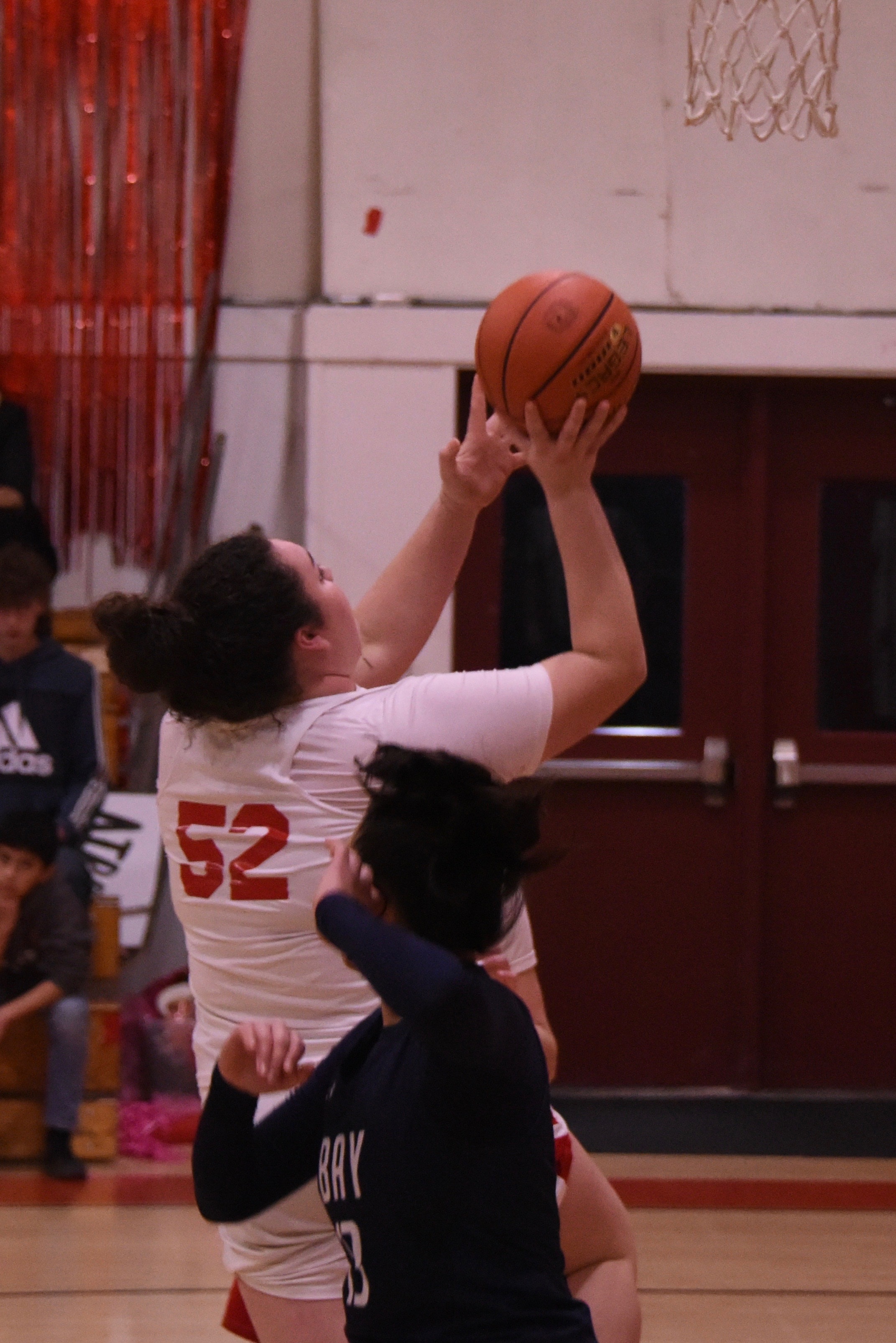 Upper Lake's Taylor Minnis drives inside for two of her team-leading 17 points against The Bay School. (Photos courtesy of Trett Bishop)