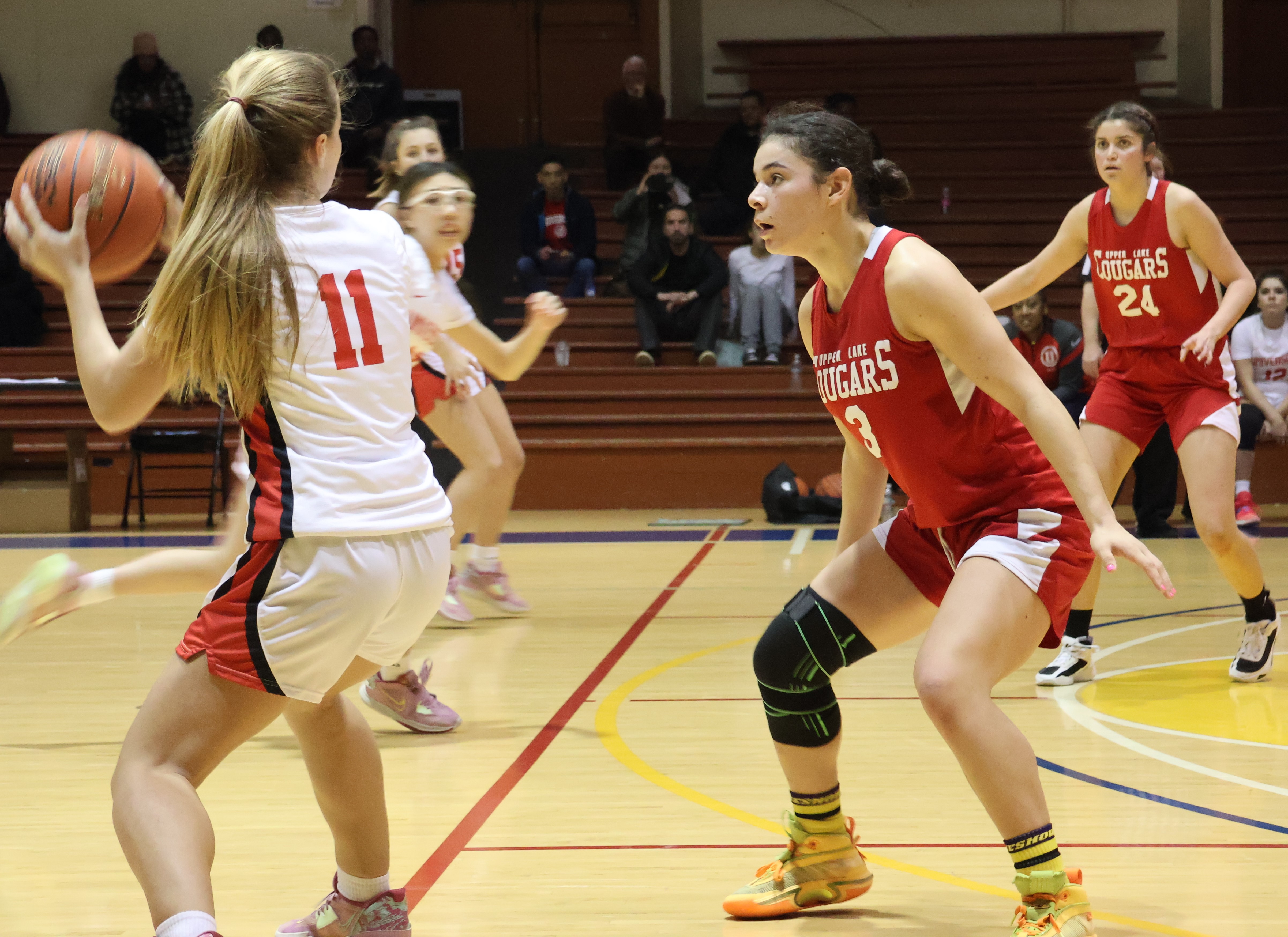 Upper Lake's Maddy Young (3) guards University's Antonia Miller in the second half Saturday night during the North Coast Section Division 5 championship game. Young led the Cougars with 10 points. Also pictured is Upper Lake's Jordann Gudmundson (24). (Photos by Brian Sumpter)