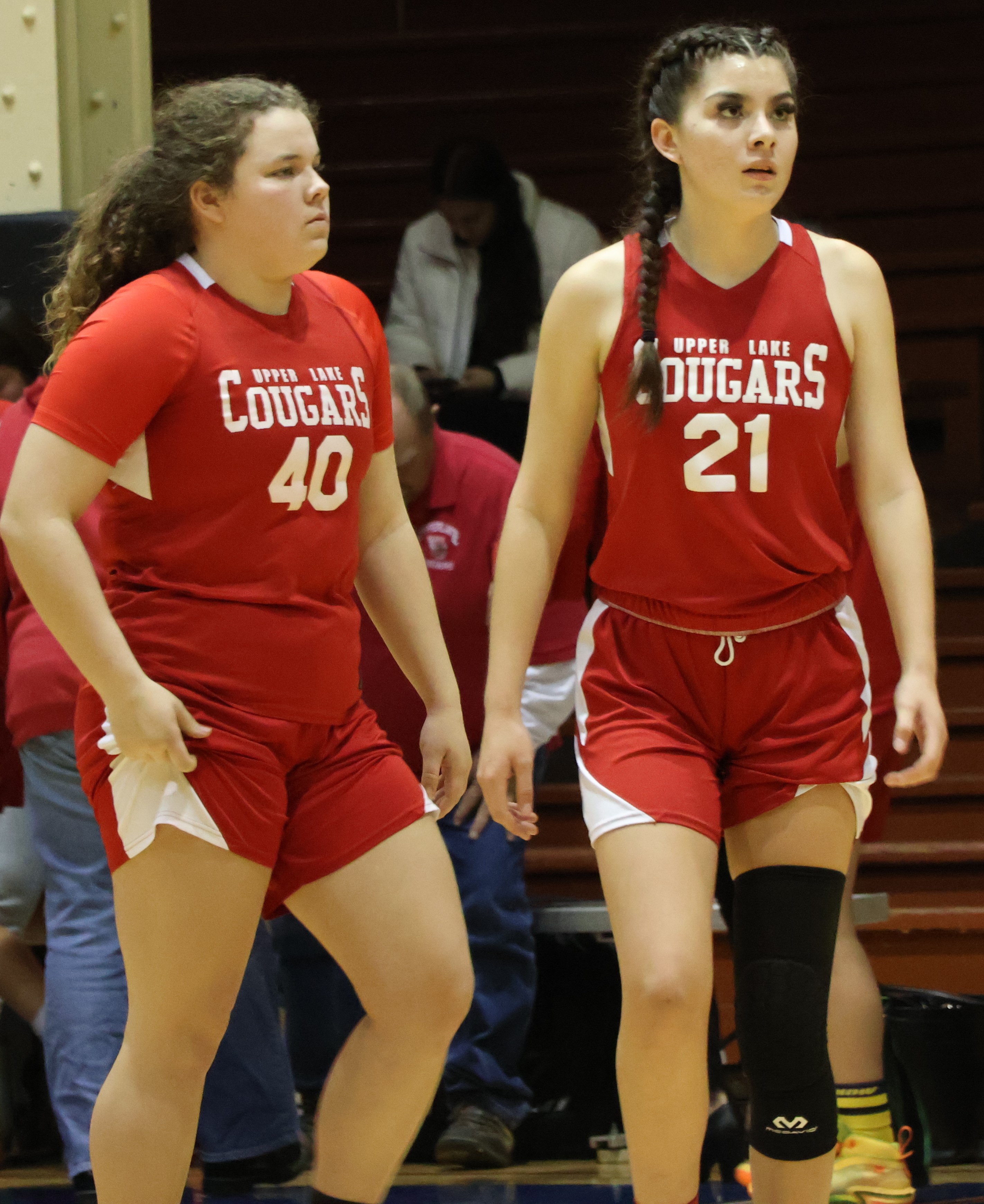Upper Lake's Kali Minnis (left) and Kat Lopez-Geary head back out onto the floor following a timeout. (Photos by Brian Sumpter)