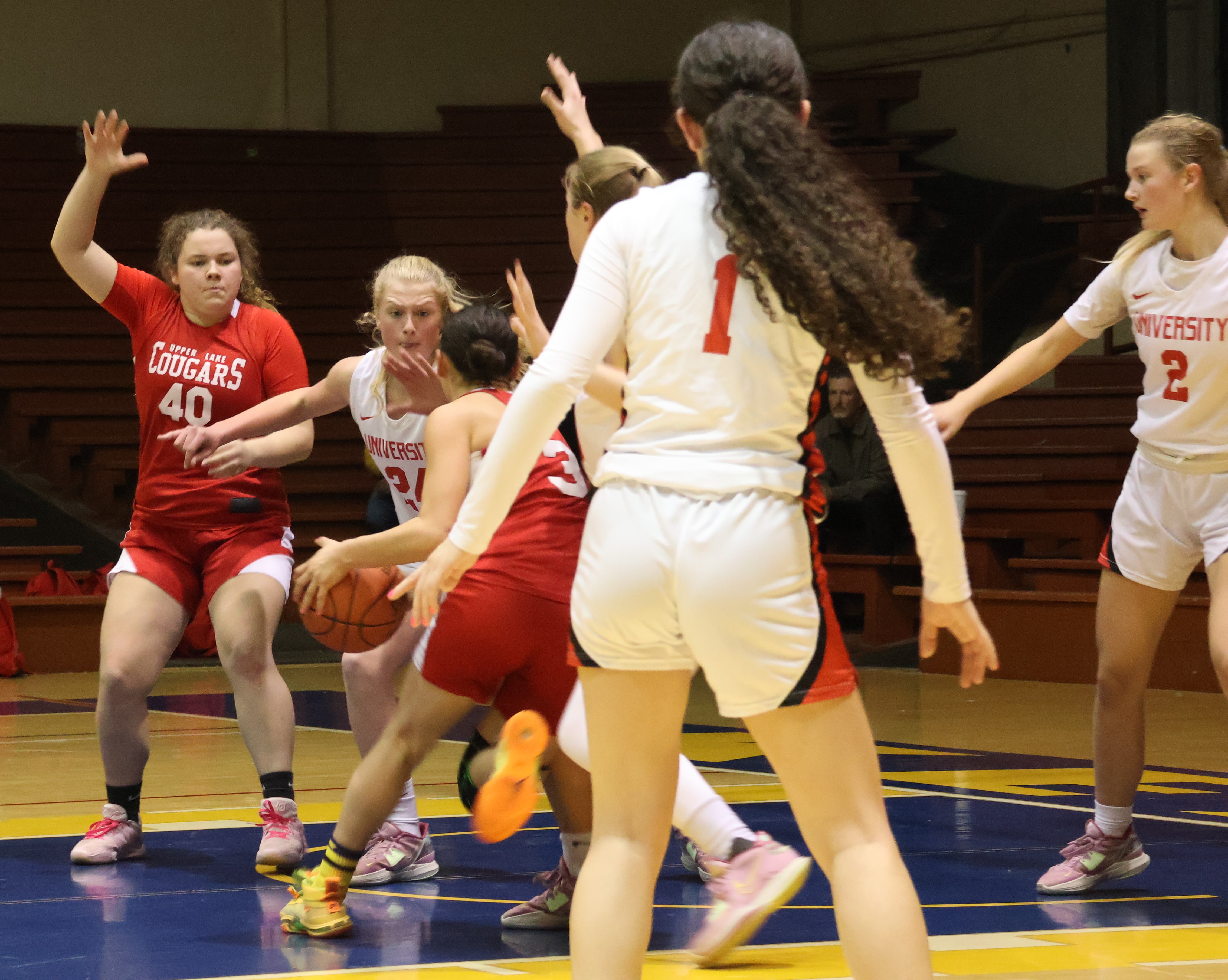 Upper Lake's Maddy Young drives inside while teammate Kali Minnis looks on. (Photos by Brian Sumpter)