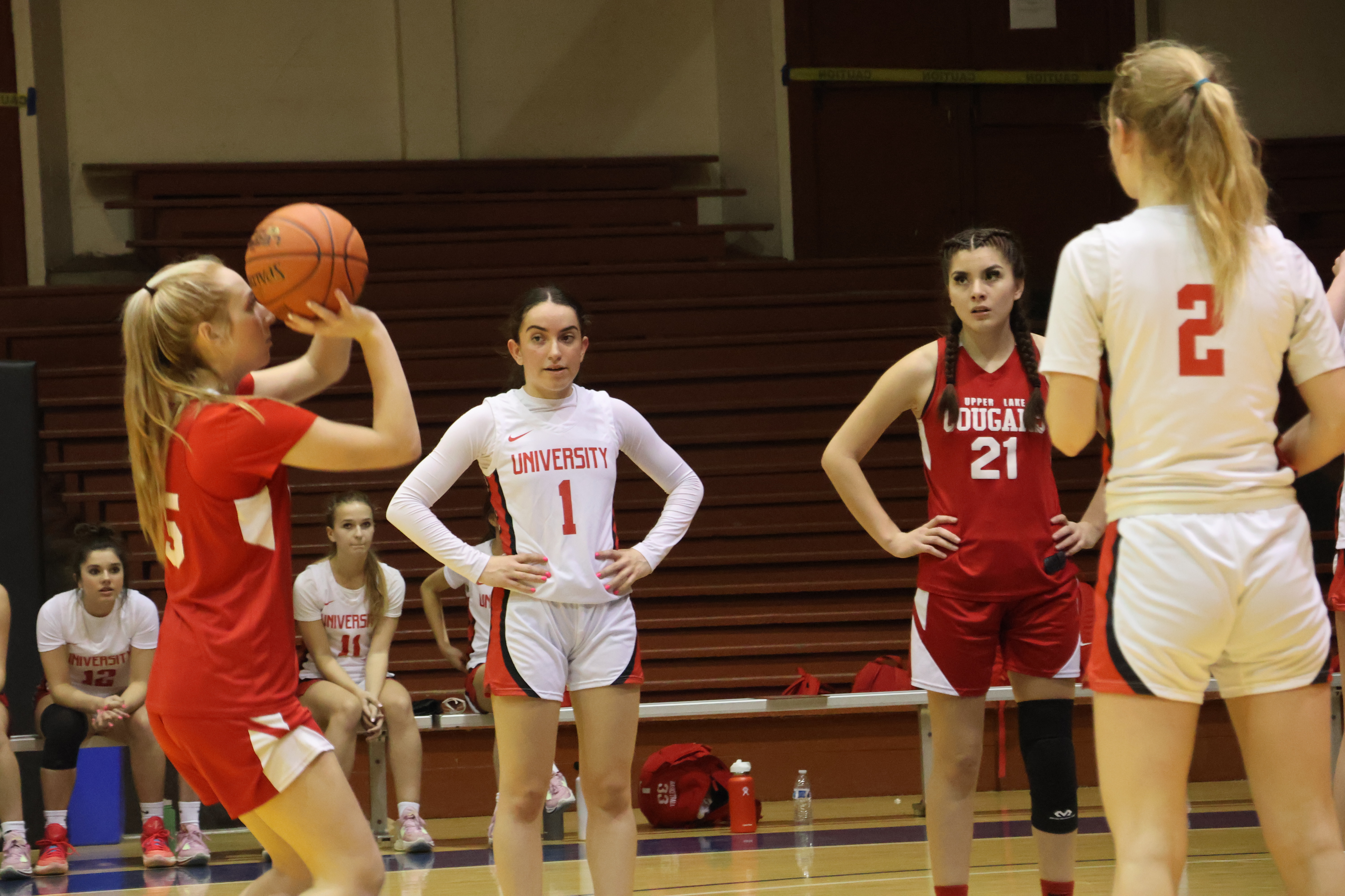 Madison Noble lines up a free throw as (from left) University's Isabella Perz (1), Upper Lake's Kat Lopez-Geary and University's Olivia Soenens look on. Noble scored eight points for the Cougars in their 63-33 loss to the Red Devils. (Photos by Brian Sumpter)