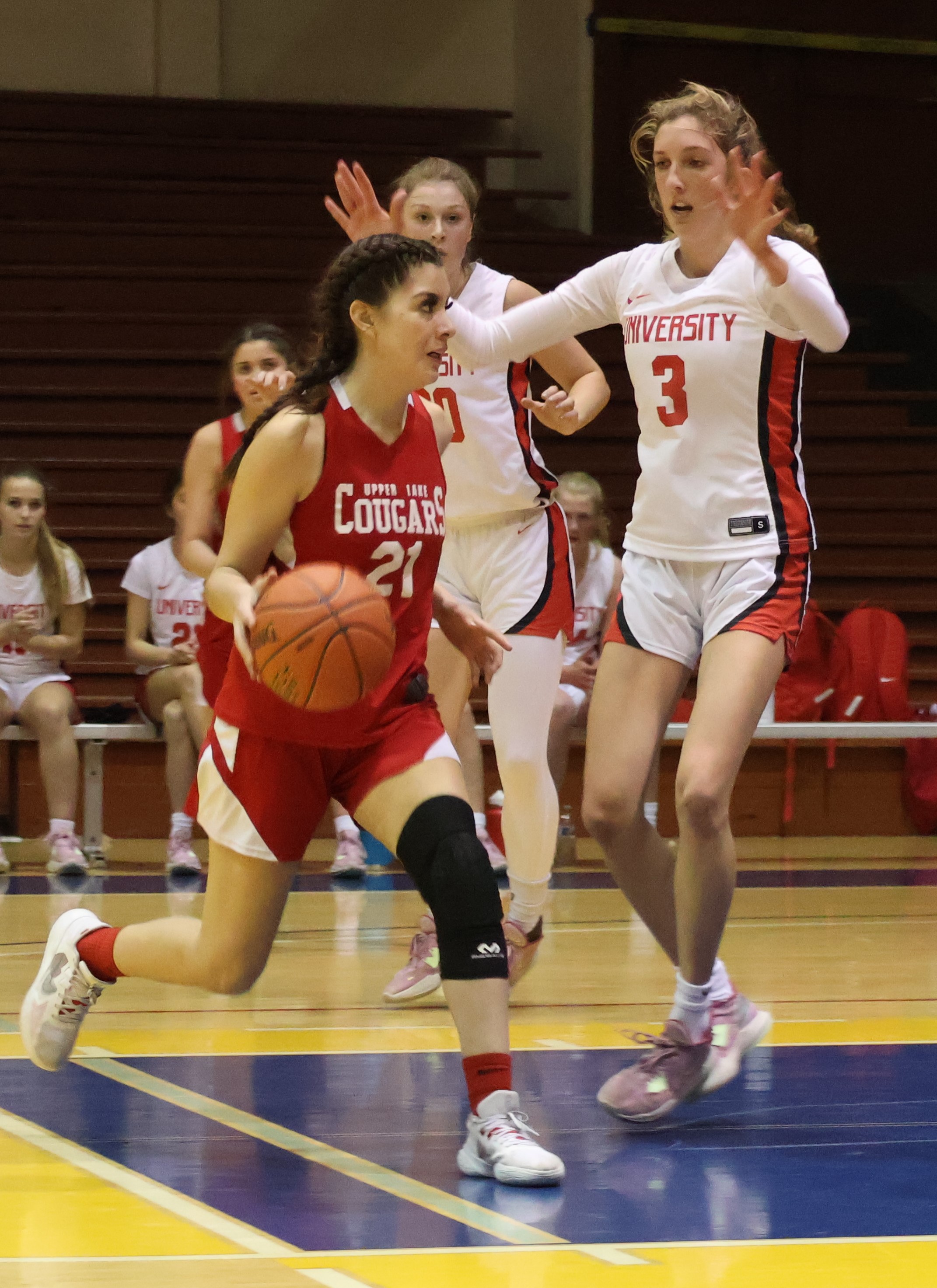 Upper Lake's Kat Lopez-Geary looks for an opening as University's Kate Kennedy (3) defends. (Photos by Brian Sumpter)