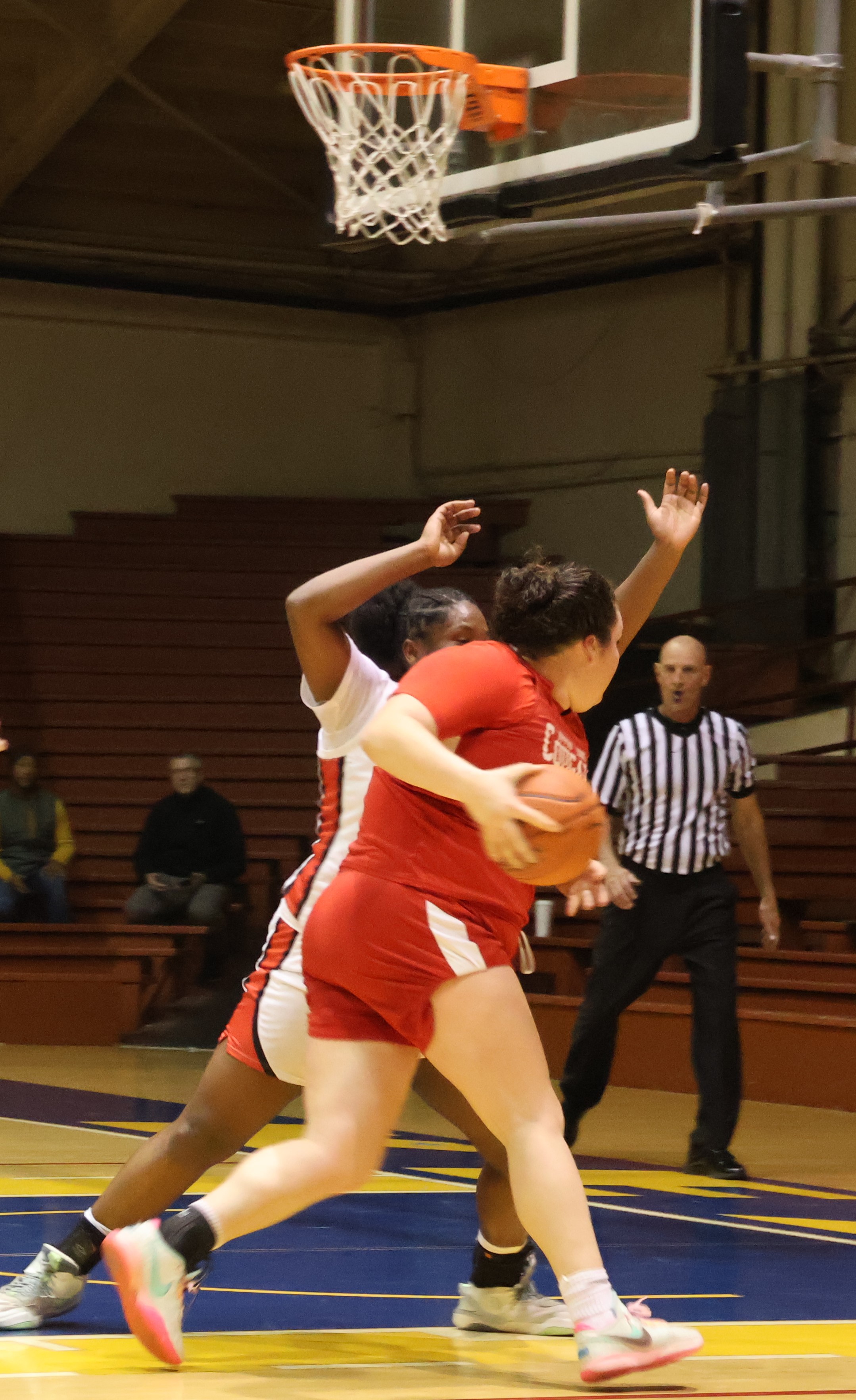 In a battle of centers, Upper Lake's Taylar Minnis drives inside against University's Damysia Walls. (Photos by Brian Sumpter)