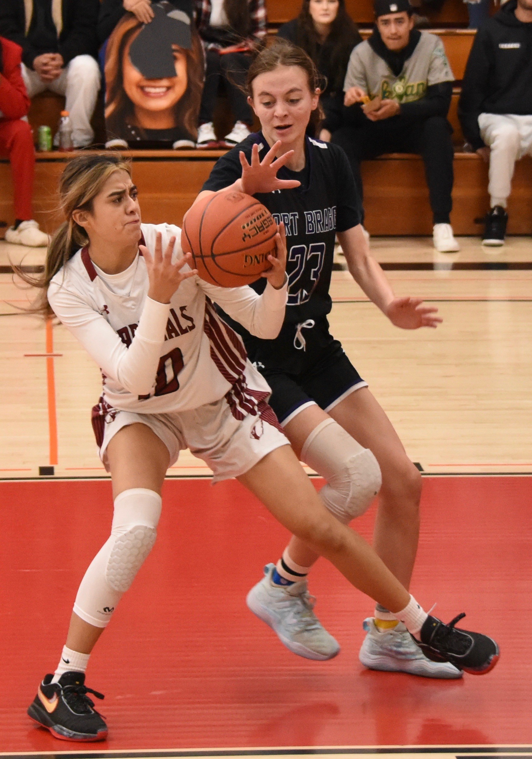 Clear Lake's Rubi Ford (left) battles a Fort Bragg player for the ball down low. (Photos courtesy of Trett Bishop)
