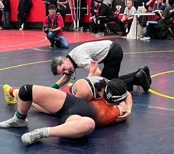 Upper Lake's Maddy Young closes in on a pin during action Friday in the 131-pound division at the North Coast Section Girls Wrestling Championships in Albany. Young pinned both of her opponents on day one of the two-day competition. (Courtesy photo)
