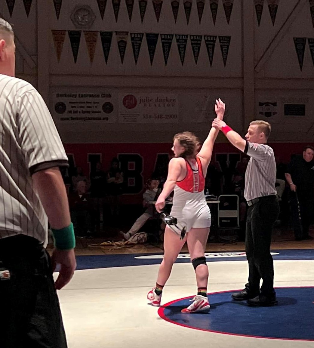 Lexy Peregrina celebrates her section championship at 150 pounds. (Courtesy photos)