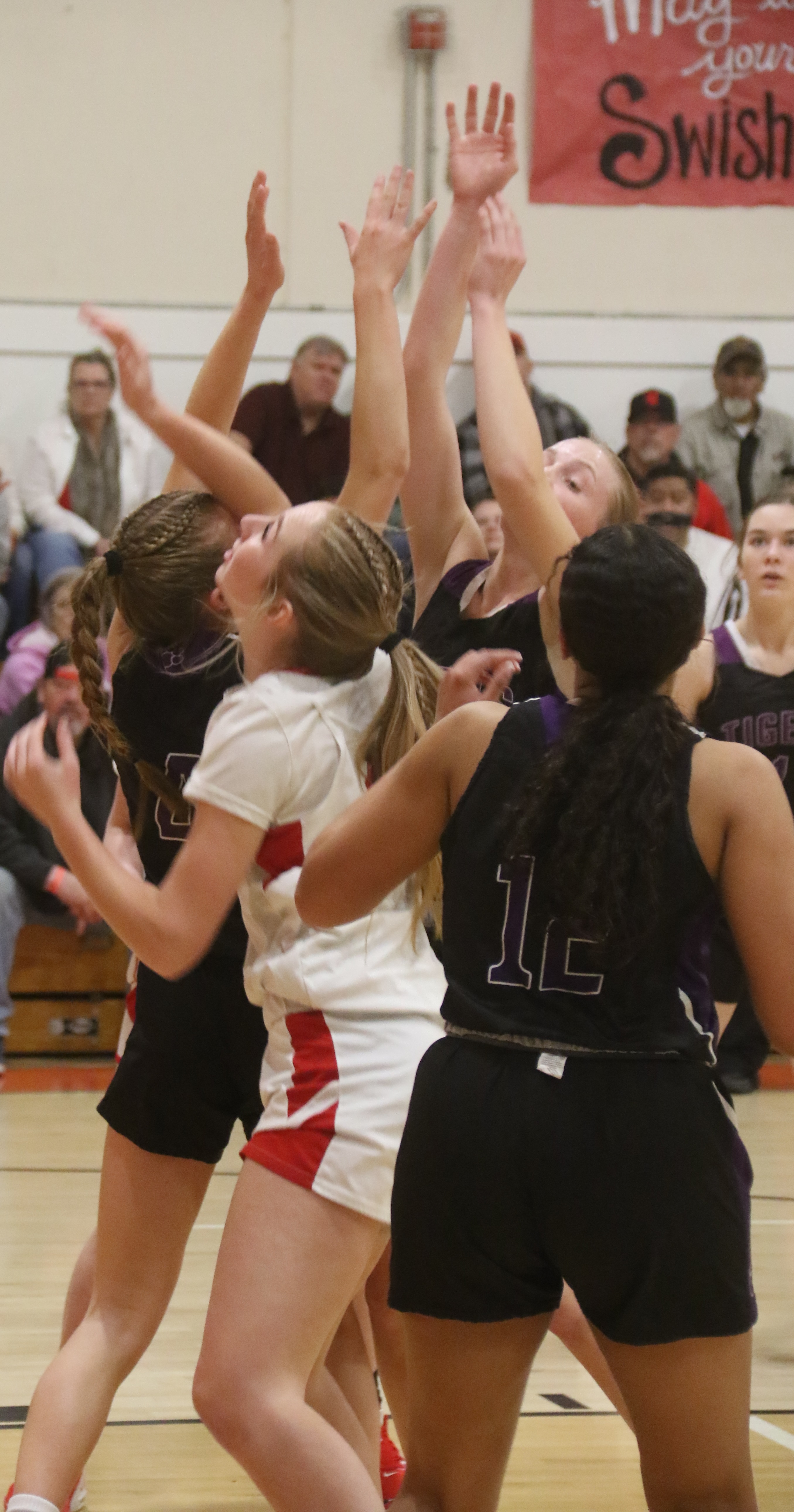 Holding her ground in a sea of Portola players is Upper Lake's Madison Noble. (Photos by Minenna Photography)