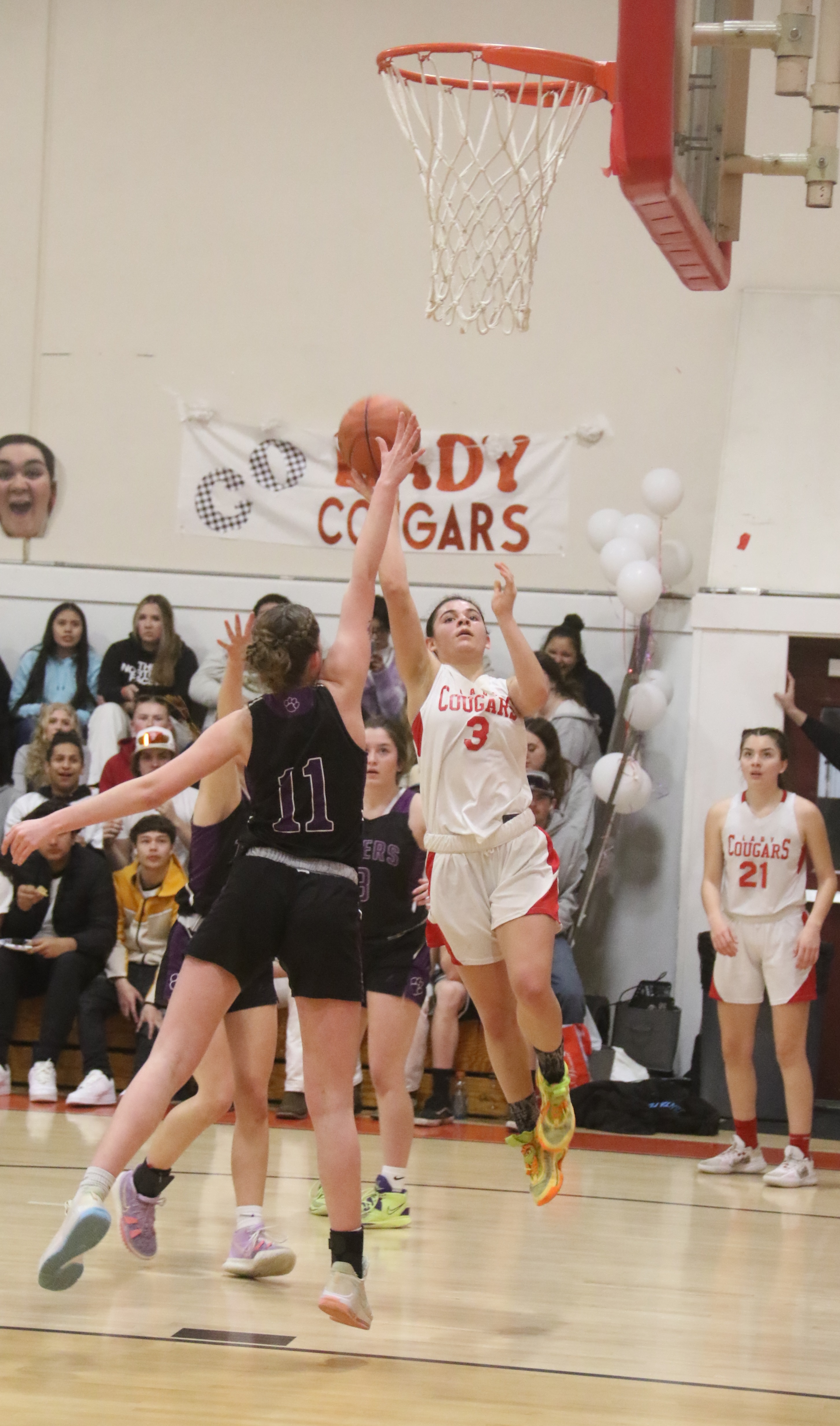 Maddy Young's shot is rejected by Portola center Emily Hughes in the second half. (Photos by Minenna Photography)