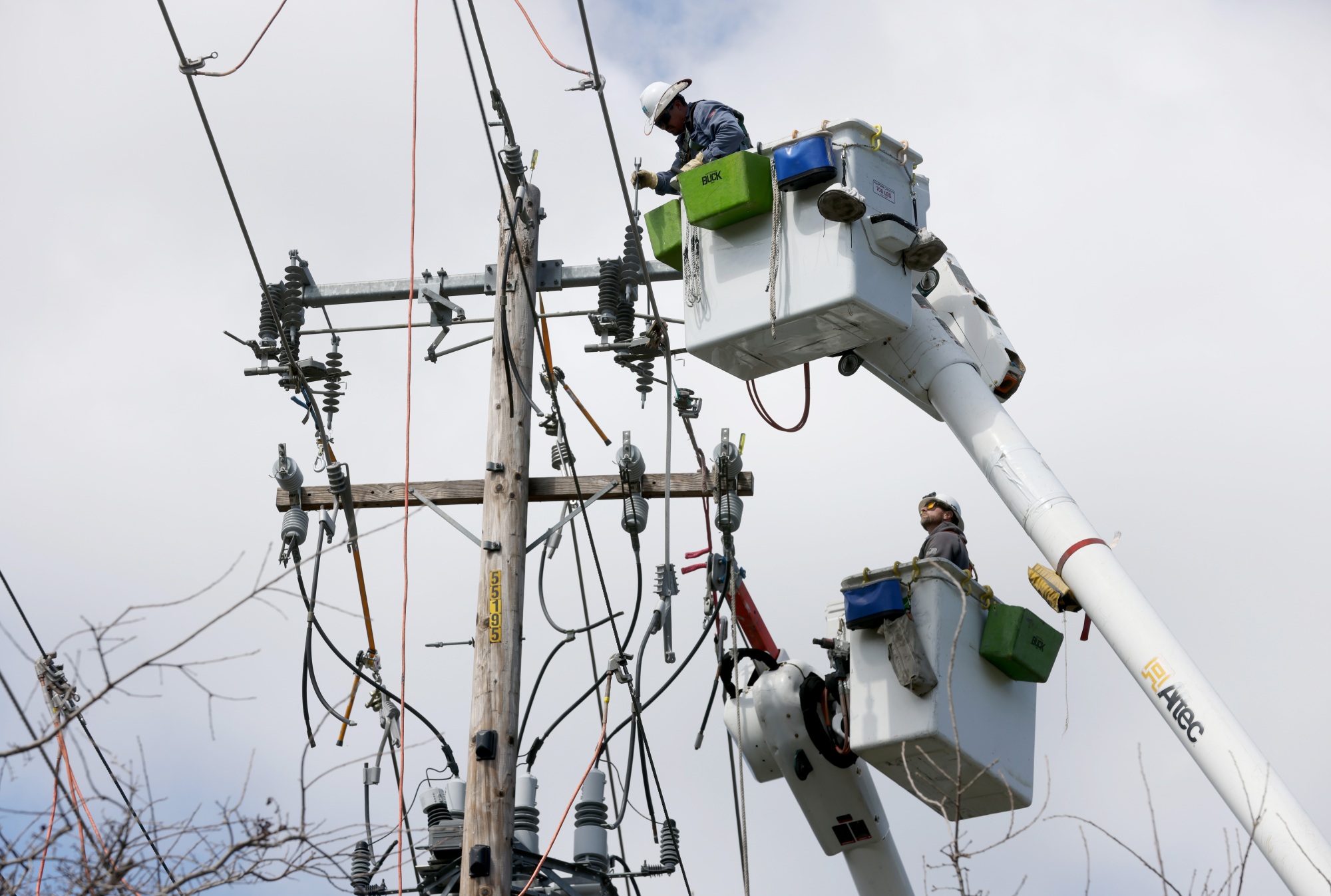 A PG&E crew makes repairs along the Iron Horse Trail near Camille Avenue in Danville, Calif, on Wednesday, March 15, 2023. Power was out in the area after yesterday's windstorm. (File: Jane Tyska/Bay Area News Group)