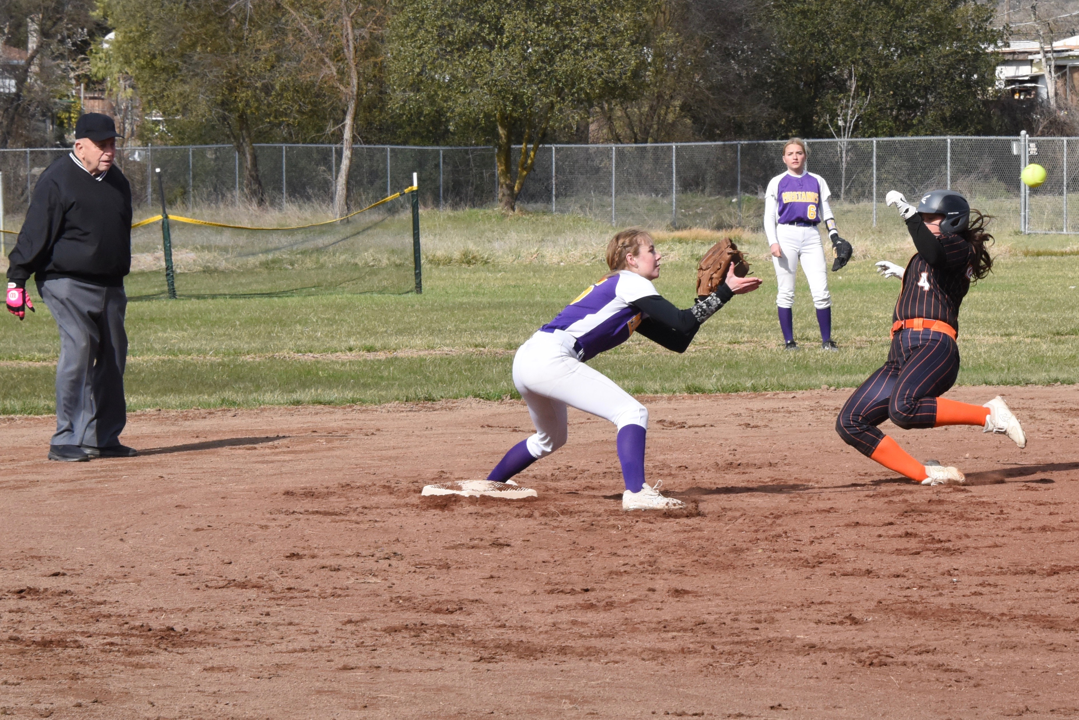 Middletown shortstop Cora Holley takes the throw at second base as Kelseyville's Mya Ogo slides into the bag on a steal attempt. Holley appeared to get the tag on Ogo in plenty of time but the call was safe. (Photos courtesy of Trett Bishop)