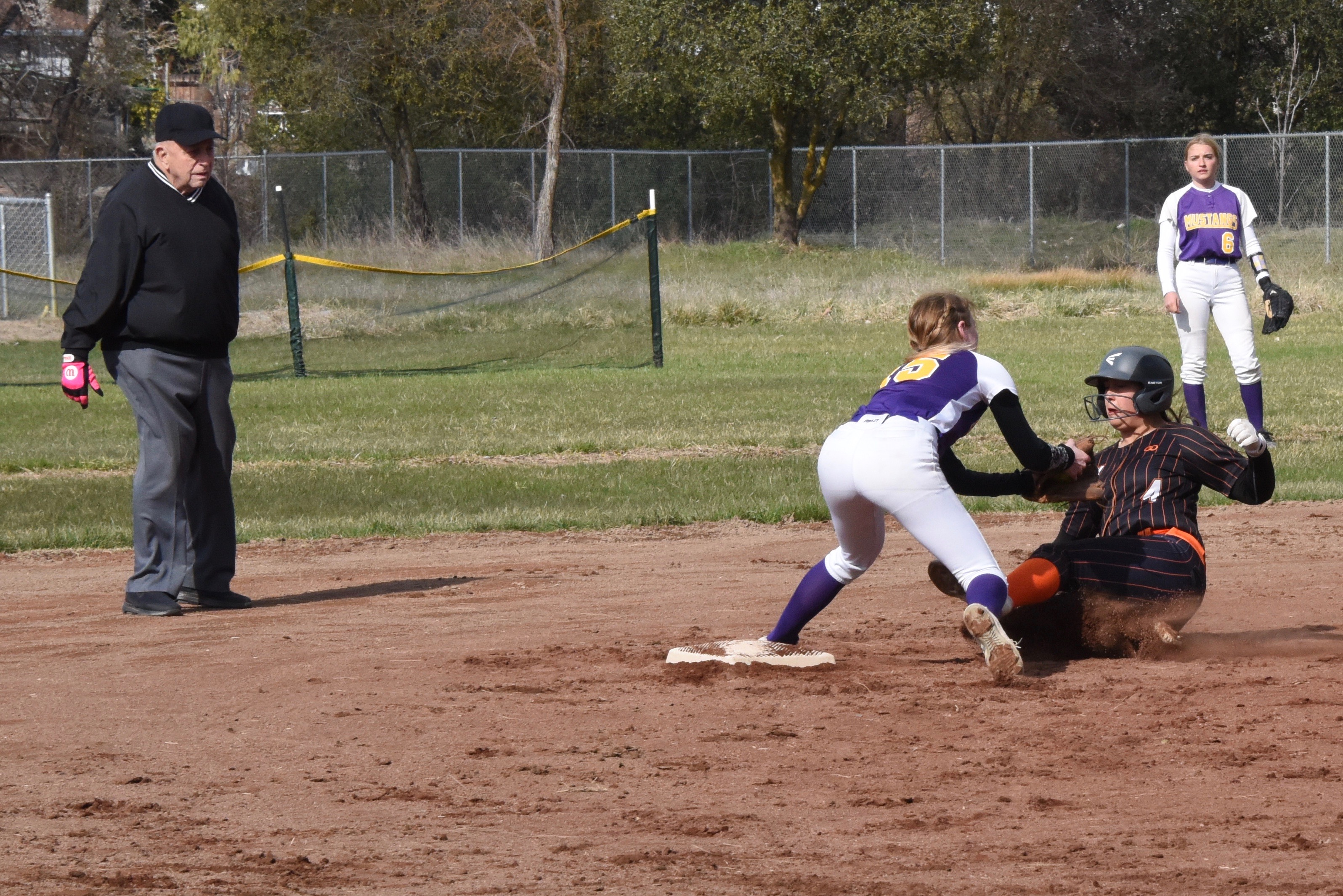 Middletown shortstop Cora Holley tags Kelseyville's Mya Ogo on the shoulder on a steal attempt during Friday's game in Kelseyville. (Photos courtesy of Trett Bishop)