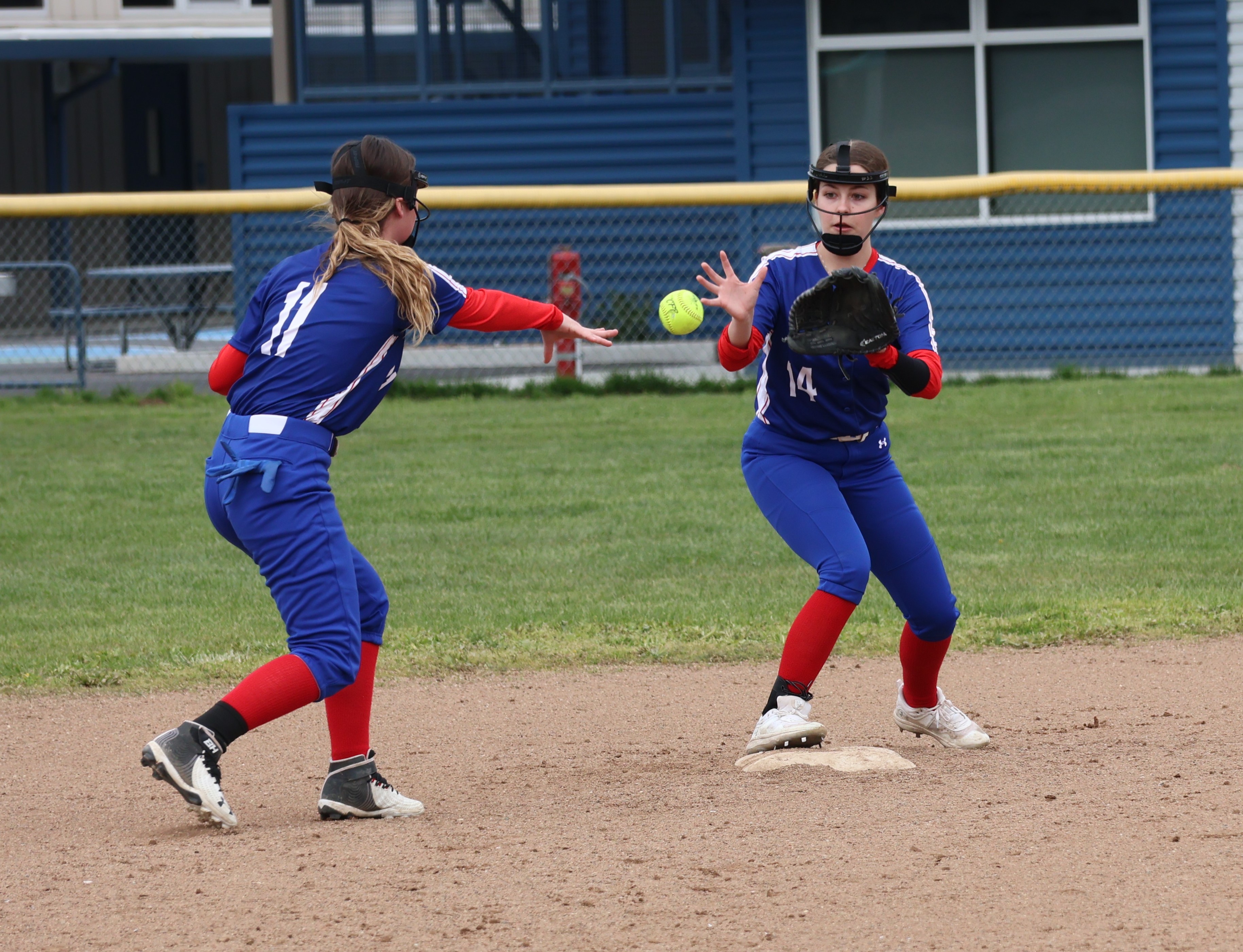 Lower Lake shortstop Brandy Klein shovels the ball to second baseman Brialyn Anderson to force a Cloverdale runner in the bottom of the second inning. (Photos by Brian Sumpter)