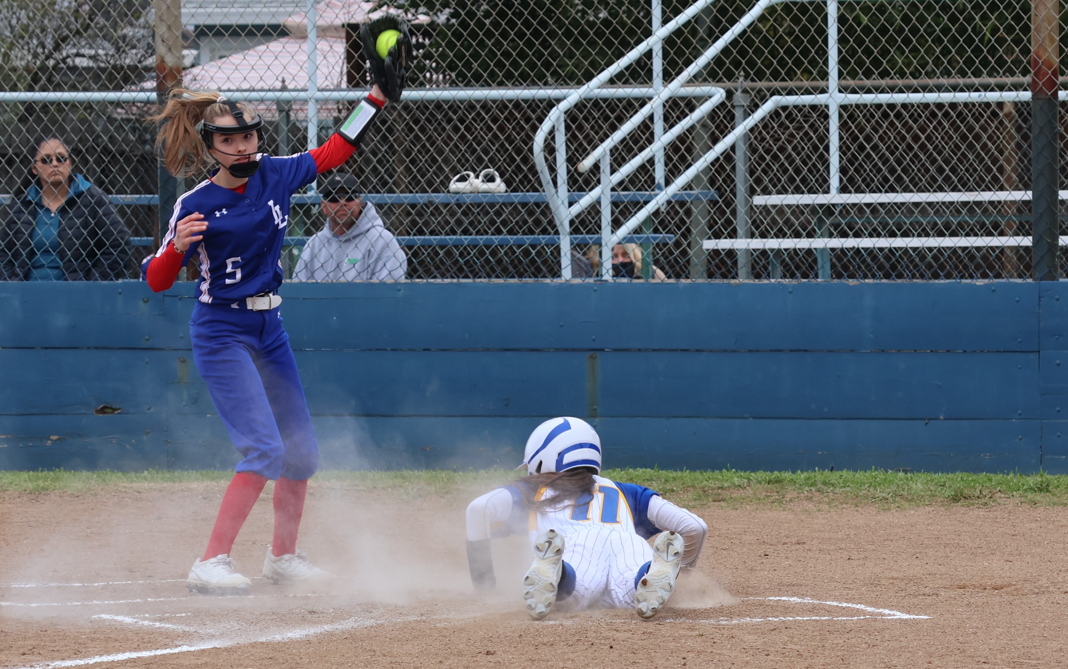 Cloverdale's Tylie Hatcher scores on a wild pitcher in the bottom of the fourth inning to give the Eagles a 5-0 lead. Looking on is Lower Lake pitcher Keeley Parks. (Photos by Brian Sumpter)