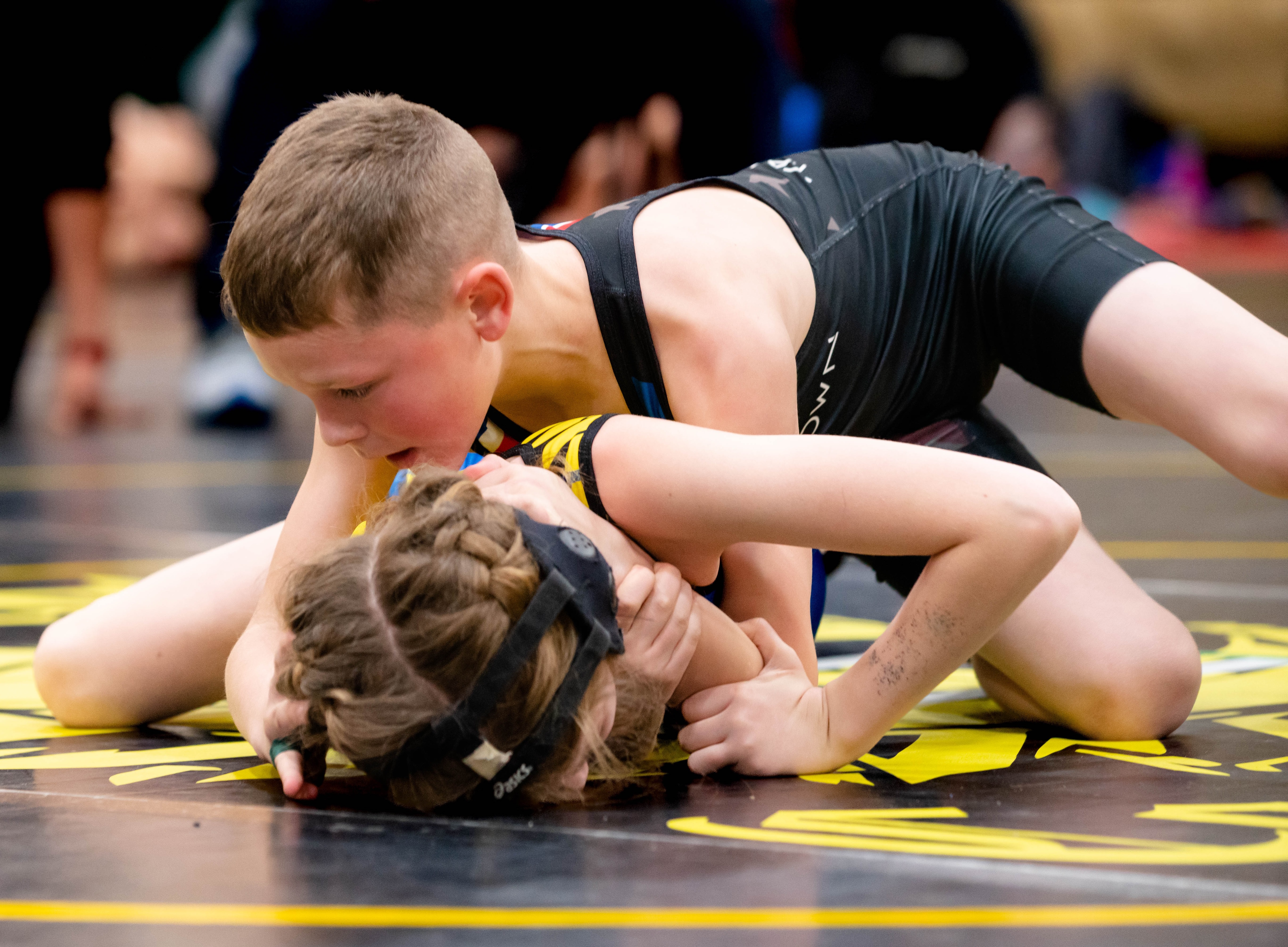 Brantley Paminto runs the half-nelson on an opponent Saturday in Willits. Paminto won his weight class. (Courtesy photos)