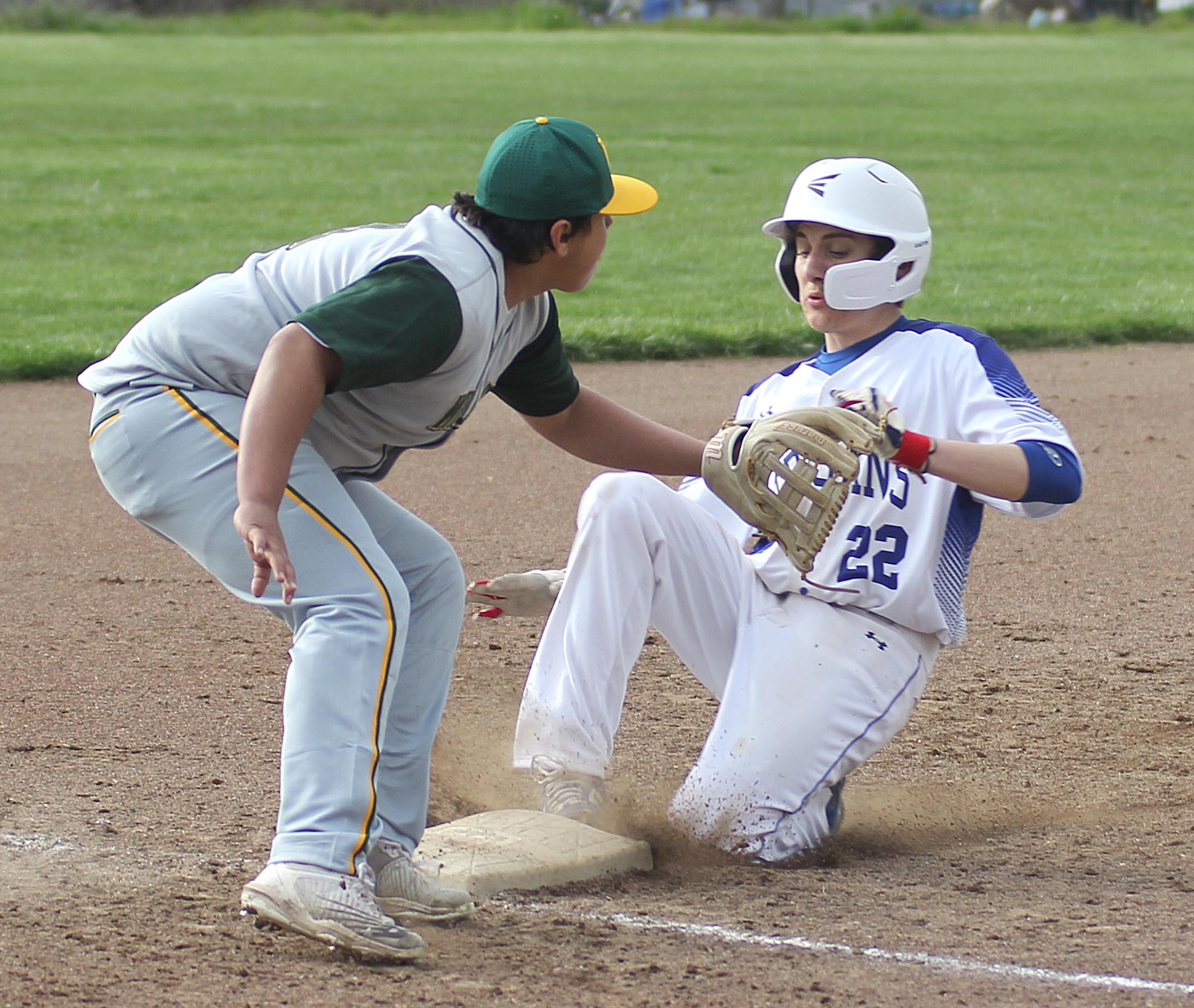 Lower Lake's Jett Guralas slides into third base during the Trojans' 9-1 home loss to the Willits Wolverines on Friday afternoon. (Photo by Minenna Photography)
