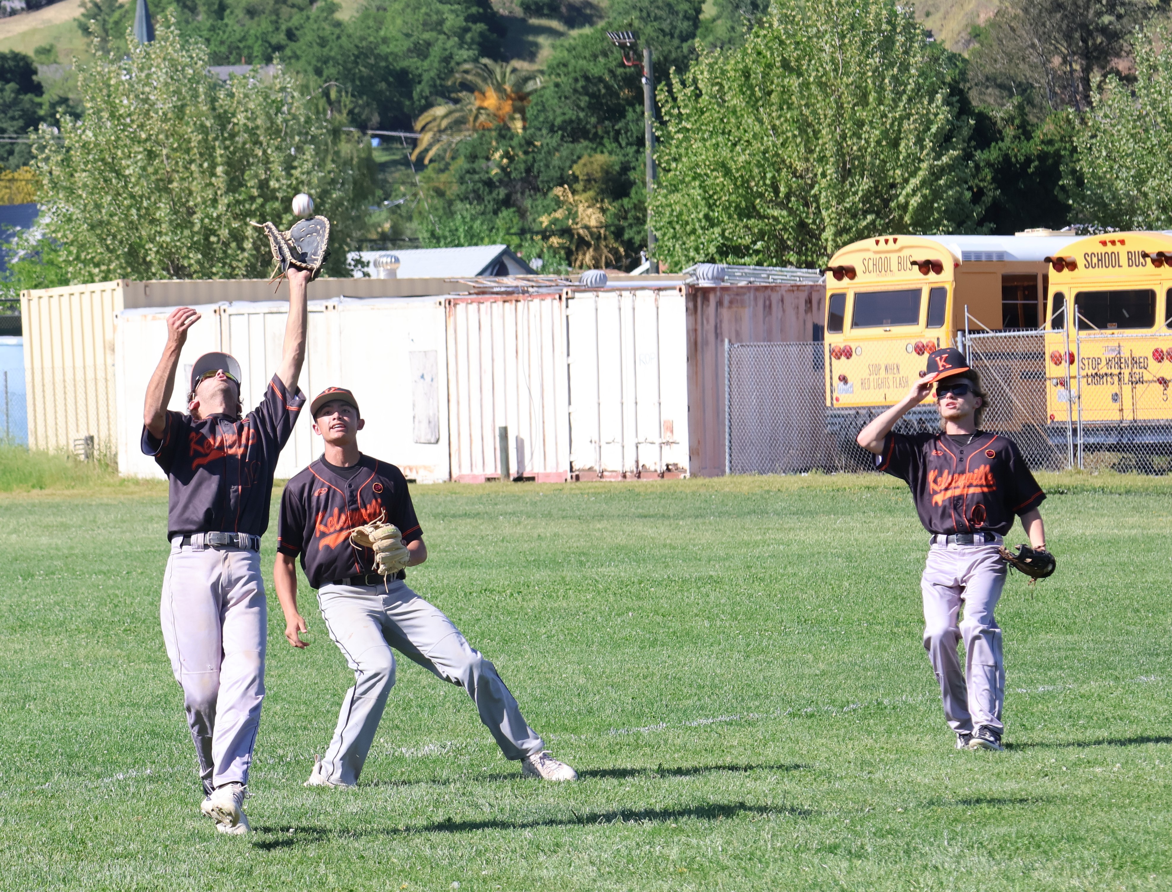 Kelseyville first baseman Andrew Huggins gloves a popup in the bottom of the second inning as second baseman Kyle Watkins and right fielder Reme Strong look on. (Photos by Brian Sumpter)