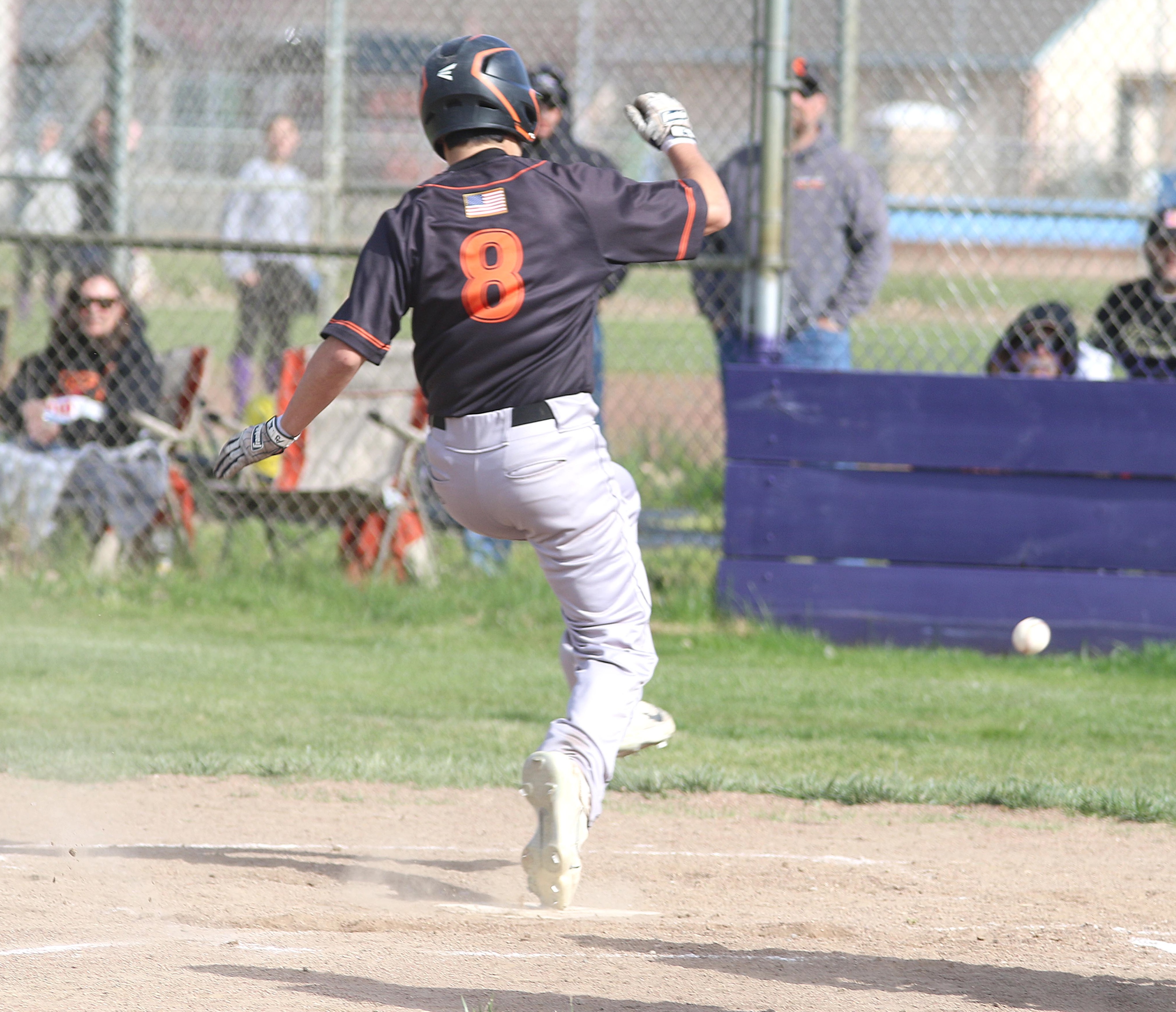 Kelseyville's Alex Cabrera high-steps his way across the plate during a 9-8 victory over Middletown. (Photos by Minenna Photography)