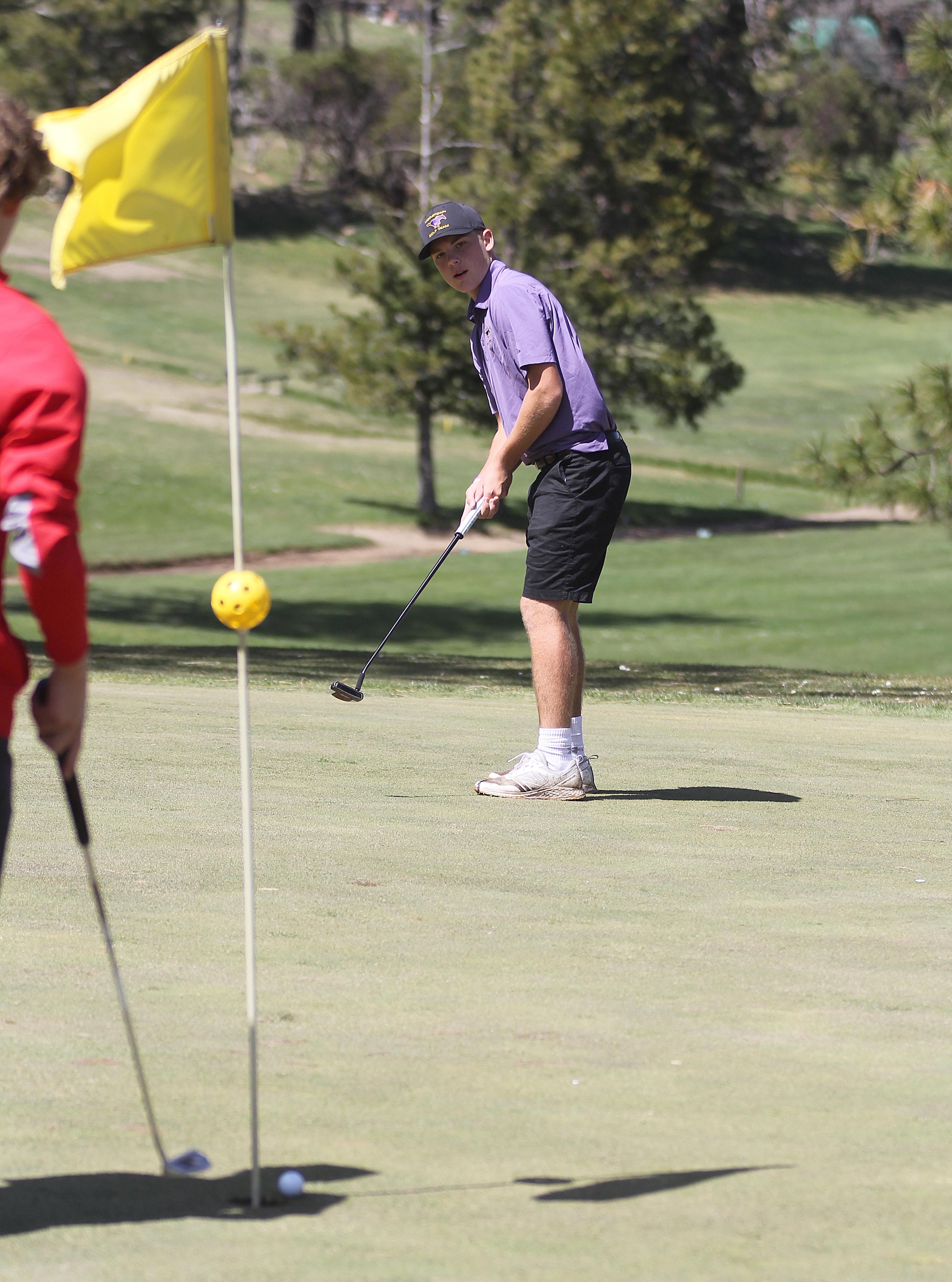 Middletown's Blake Costlow follows the roll of his putt as it approaches the pin during Thursday's action. Costlow's 79 was the day's second-best score. (Photos by Minenna Photography)
