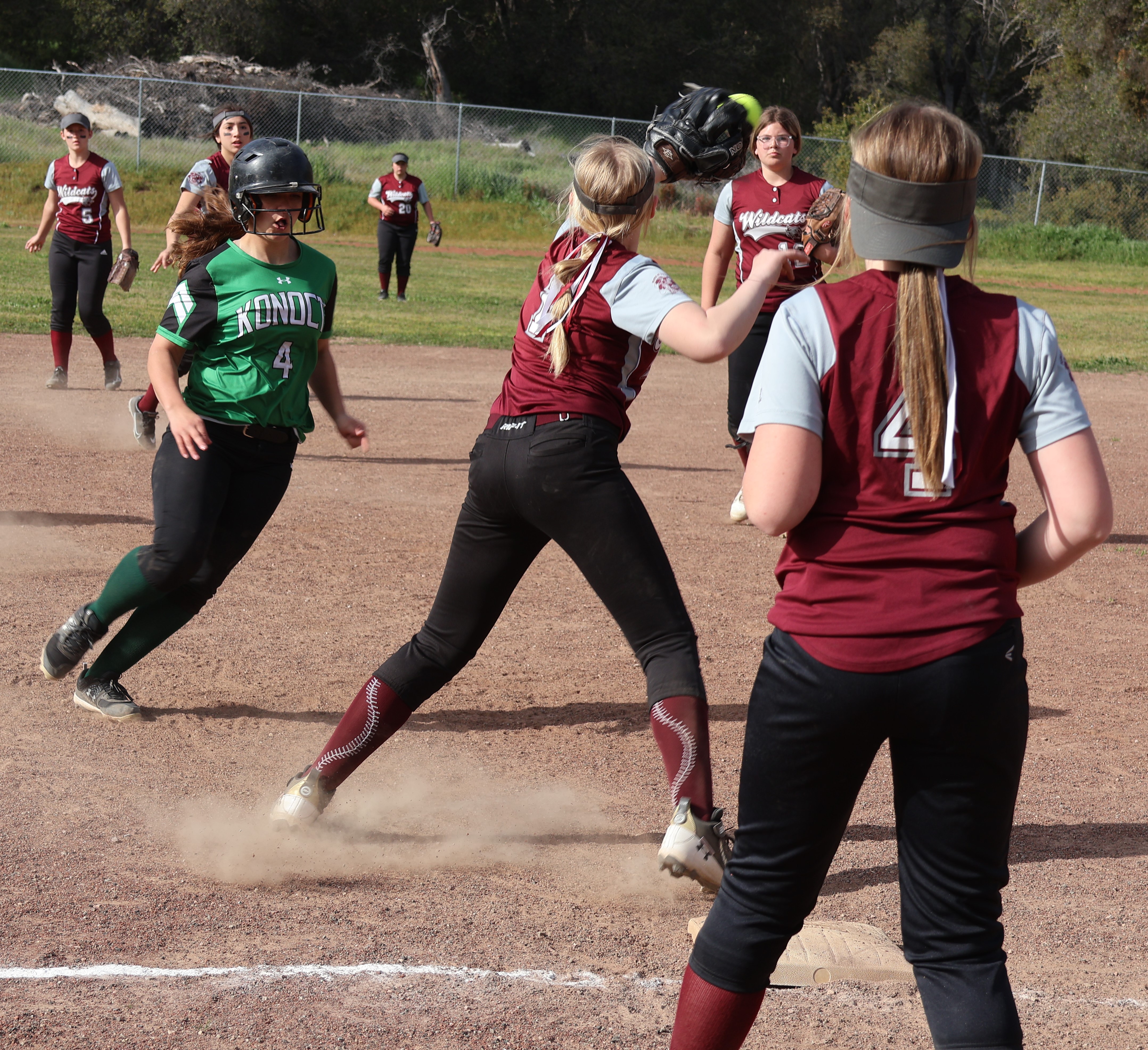 Upper Lake's Aubree Sperber takes the throw at third base as Jordyn Parker backs up the play during a rundown that Konocti's Maddy Garner eventually scored on when the throw got away from Sperber. (Photos by Brian Sumpter)
