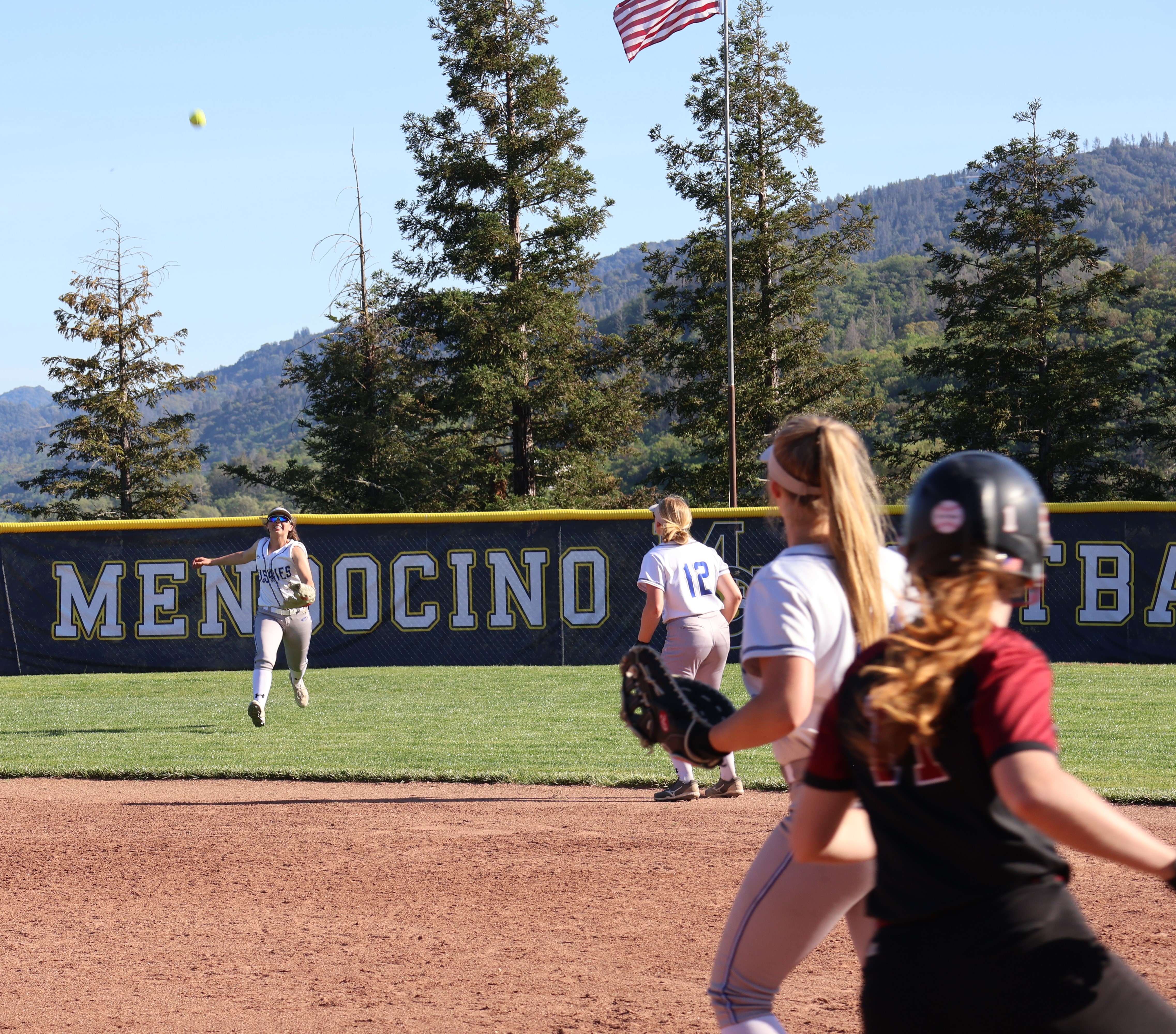 Clear Lake's Stella Hill looks on as her flyball drops in front of Fortuna center fielder Myra Hayes for a RBI single in the sixth inning. (Photos by Brian Sumpter)
