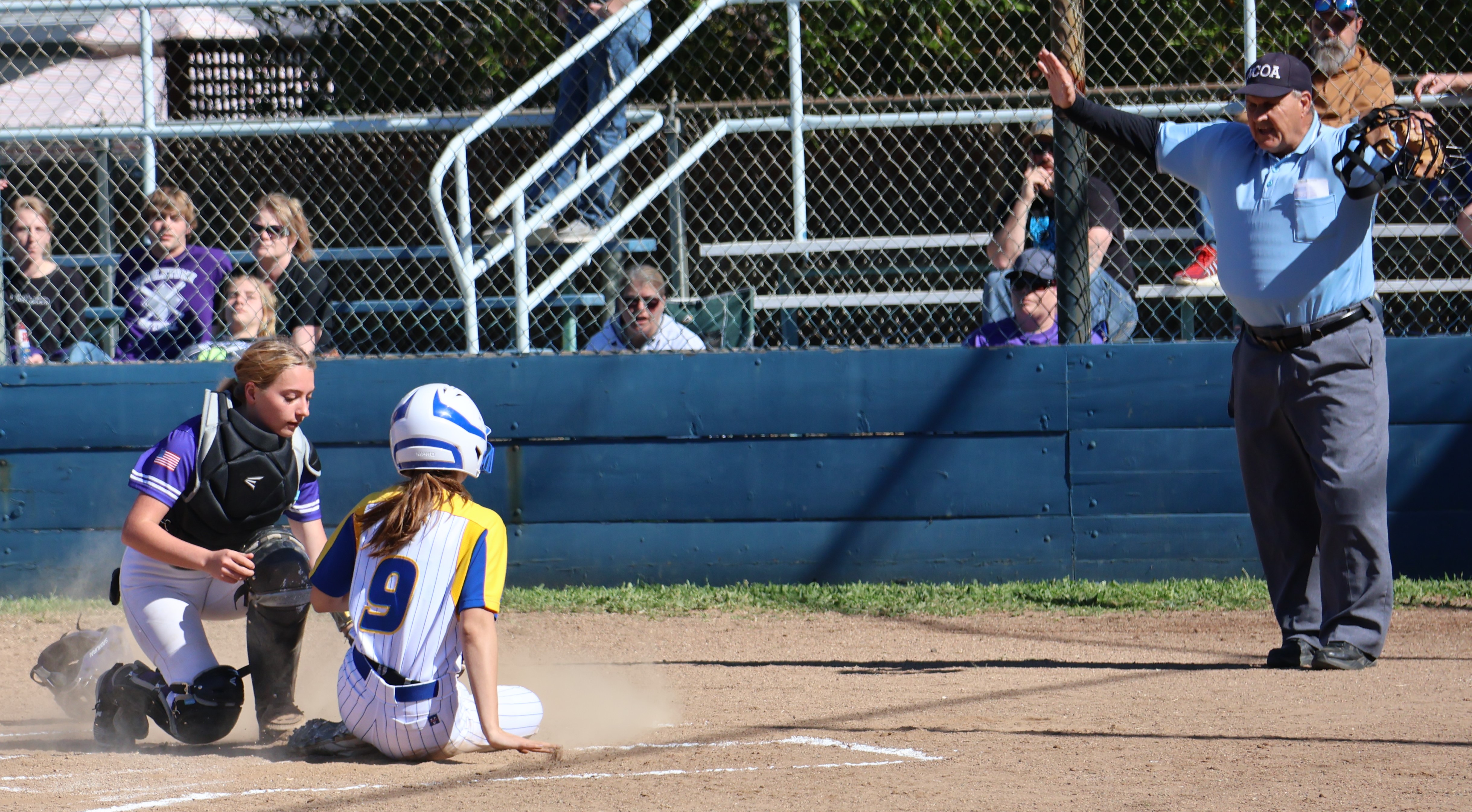 Cloverdale's Shea Santana is safe at home despite the best efforts of Middletown catcher Carina Fleenor. (Photos by Brian Sumpter)