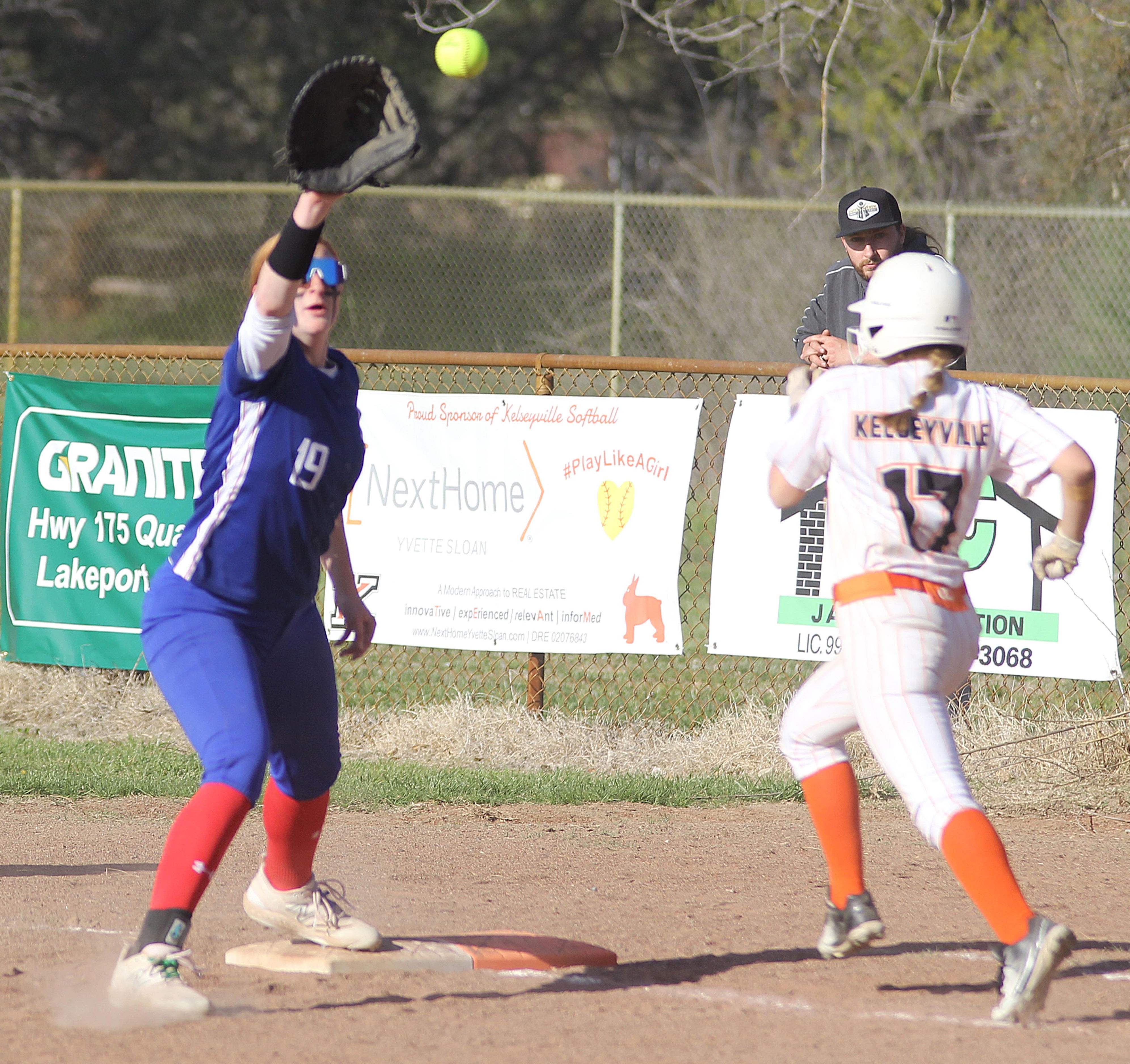 Lower Lake first baseman Rebecca Theodorou takes the throw at first base as Kelseyville's Kat Wheelan races for the bag Friday afternoon in Kelseyville. (Photos by Minenna Photography)