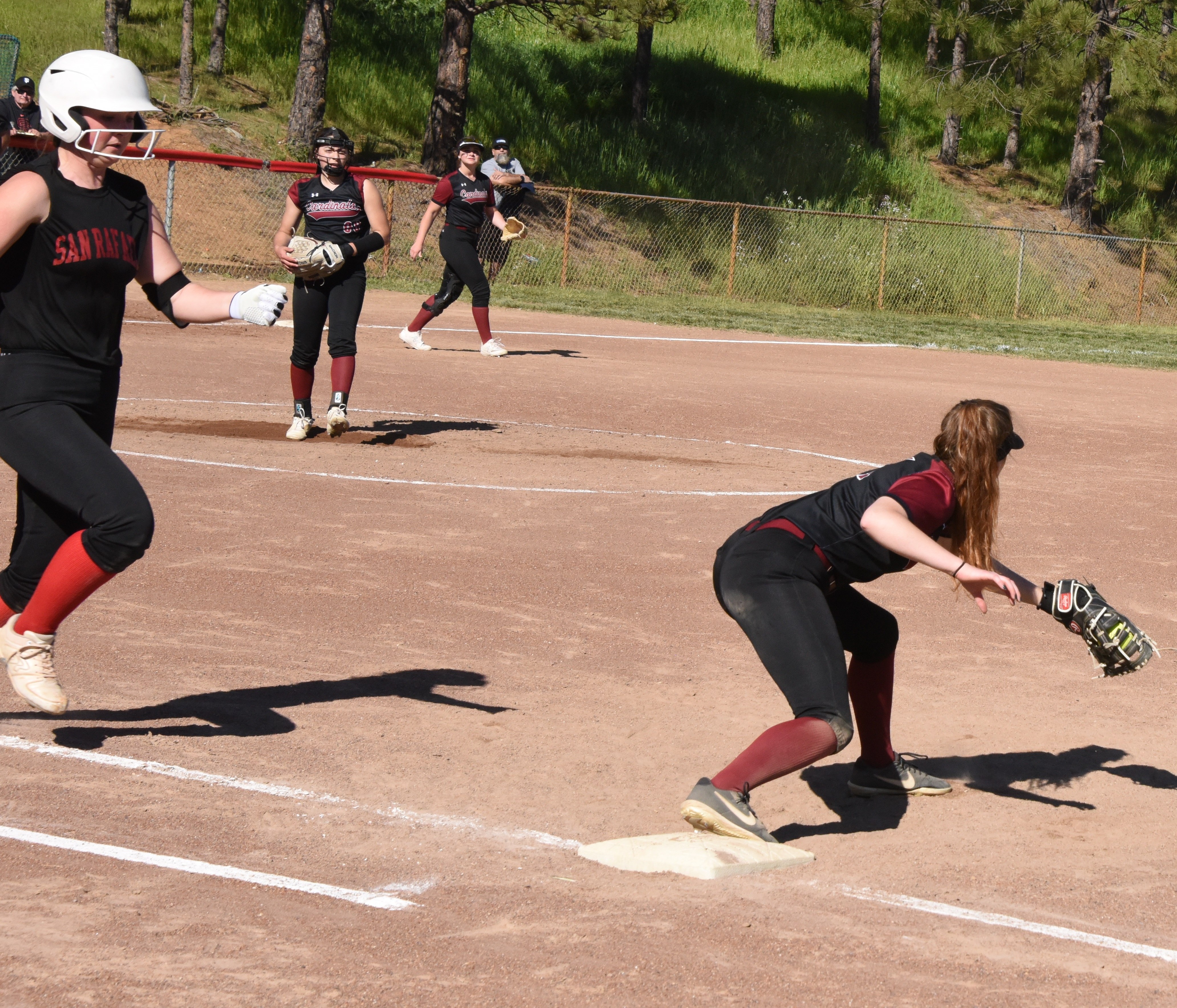 Clear Lake first baseman Stella Hill pulls in the throw from shortstop Amber Smart in the top of the third, part of an inning-ending double play. (Photos courtesy of Trett Bishop)