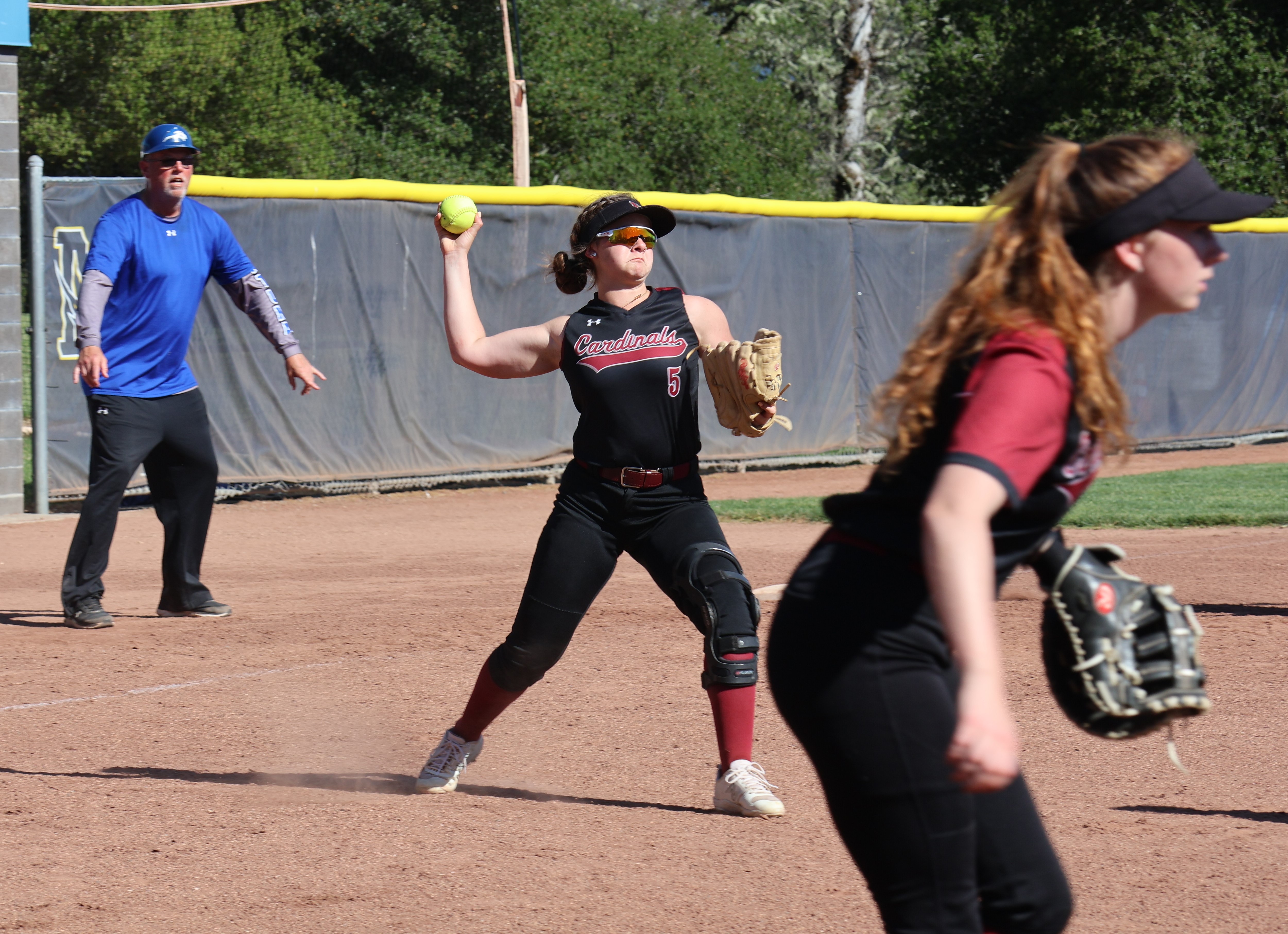 Clear Lake third baseman Camrin Pivniska throws to first base after fielding a bunt by a Fortuna player. (Photos by Brian Sumpter)