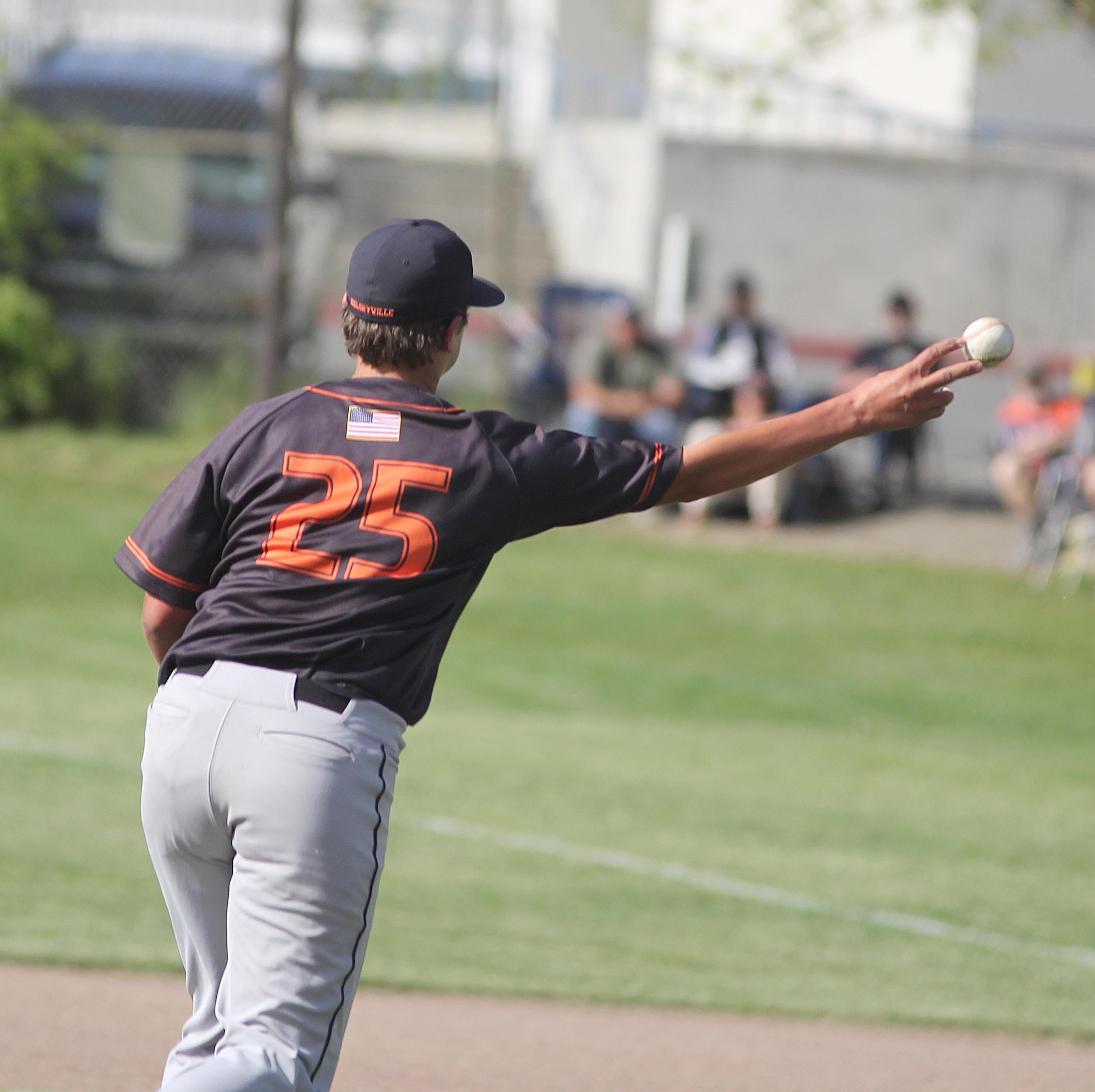 Kelseyville pitcher Brock Barrick chases a Lower Lake runner back to first base with a pickoff throw Tuesday afternoon. Barrick worked into the sixth inning of the Knights' title-clinching 10-1 win over the Trojans. (Photos by Minenna Photography)