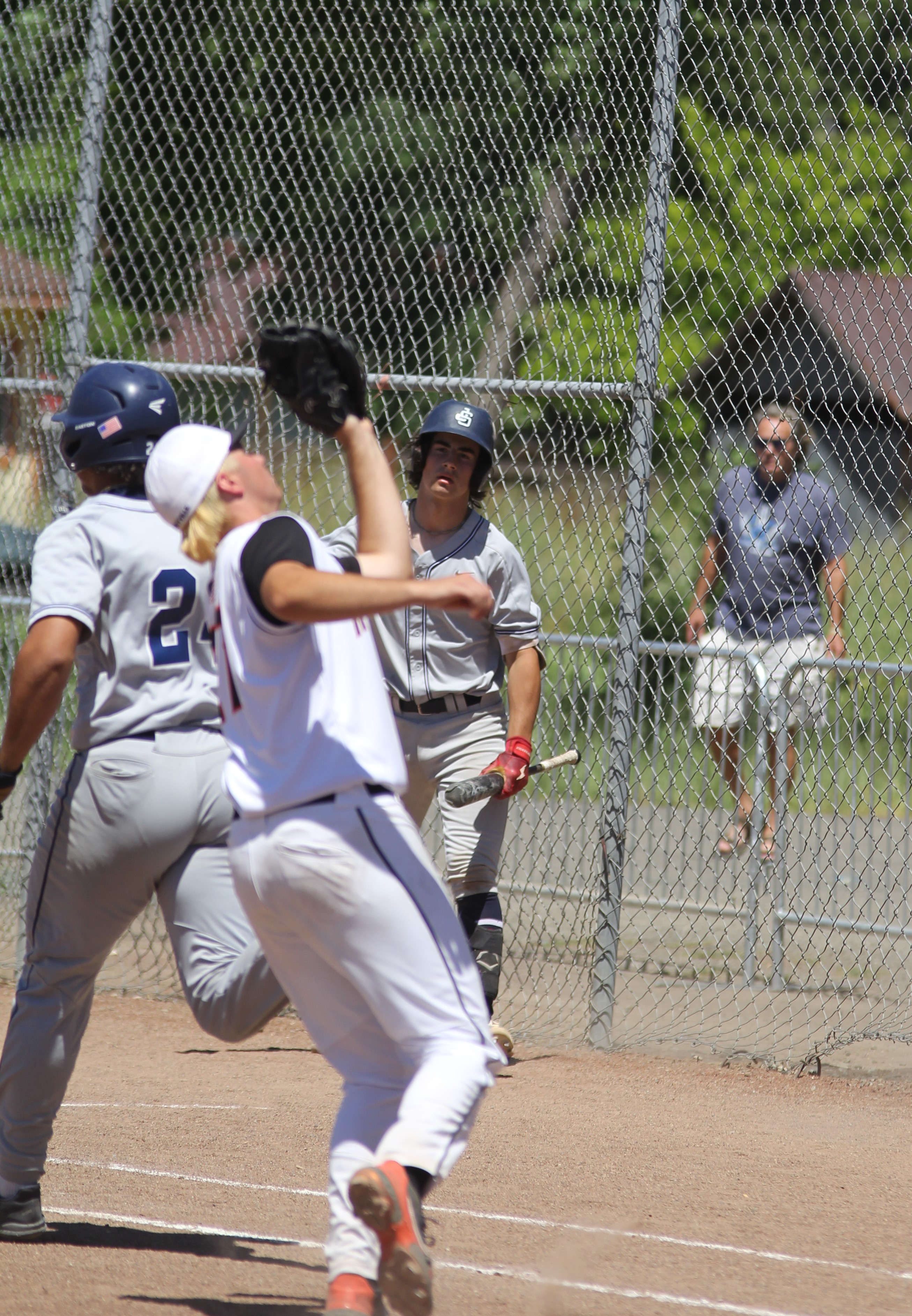 Kelseyville pitcher Zayne Barker gloves a popup off the bat of Justin-Siena's Dalen Tinsley for the first out of the seventh inning. Barker worked five effective innings in relief of starter Jon Dougherty. (Photos by Minenna Photography)